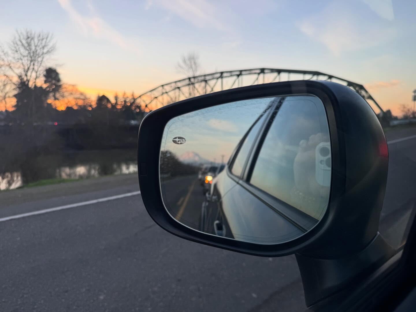 We have 39 minutes and 53 seconds more daylight today than we did on the solsticeā2 minutes and 19 seconds more than we had yesterday.
Now the sun is setting at 4:55 and I donāt have to race quite as fast to get in a walk. The sun will rise at 7:46 am and I wonāt feel quite so much like half my day is over before that ever happens.
Also, I have been on the lookout for photos of the sun. Last night, Q and I saw glorious views of crows roosting in the black tree branches and of Mount Rainier while we were stuck in that interminable line up at the Clarkās Creek bridge on the way back from our late afternoon appointment in Federal Way.
The wait was okay once I started paying attention to that winter beauty.
#lightwatch #artwordsandyoga