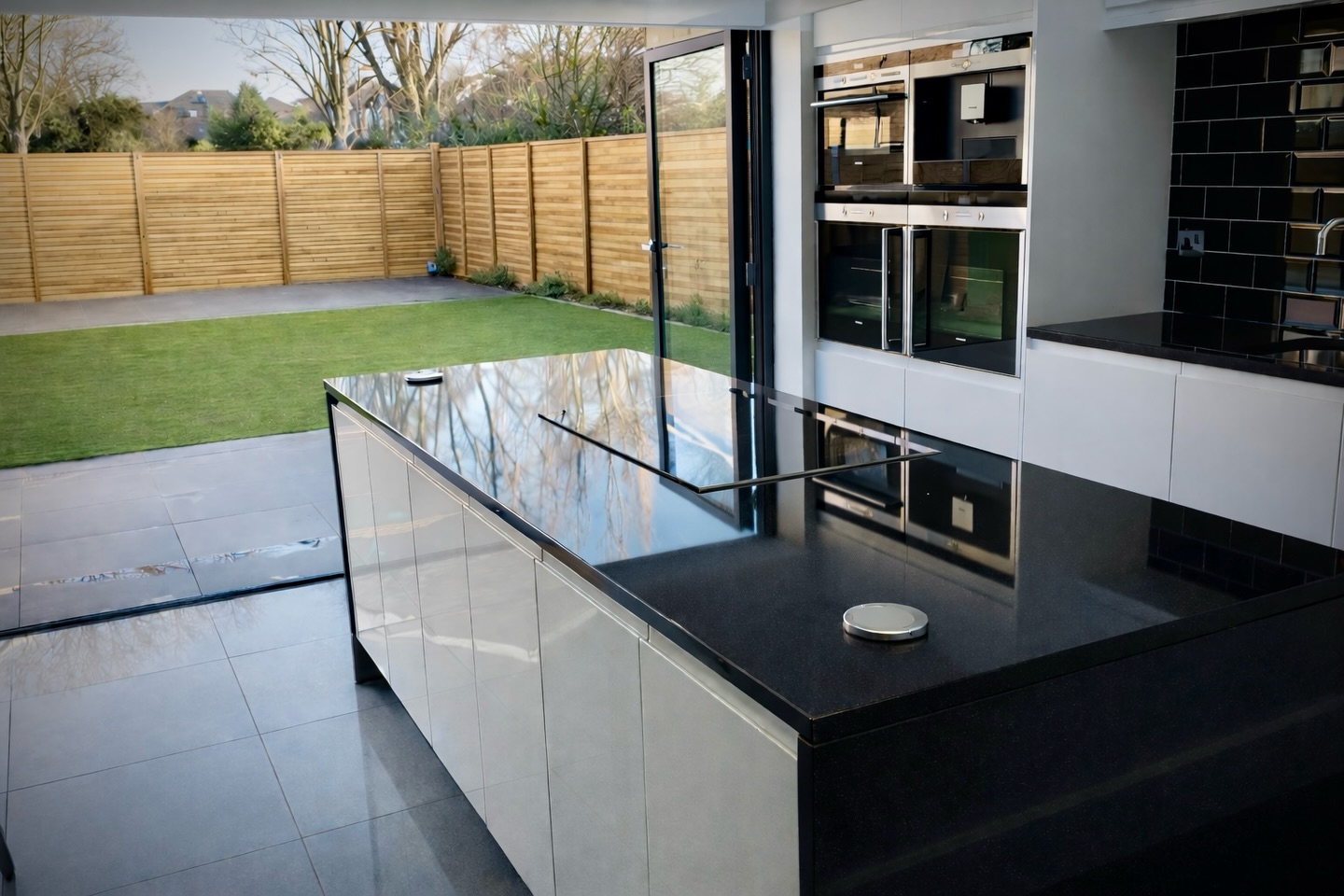 A clean, contemporary kitchen designed to open directly onto the garden.
Large glazed openings create a strong connection between inside and out, allowing the space to work effortlessly for everyday use and entertaining. The layout was kept simple and functional, with the island providing a practical focal point without interrupting flow.
Material choices and detailing were deliberately restrained, focusing on durability, balance and how the space would be used over time.
If you’re planning a rear extension, new kitchen or downstairs reconfiguration, we’re always happy to talk through ideas and next steps.
📍 Essex
📞 07734 256314
🌐 www.ecobuilders.green
#EcoBuilders #KitchenDesign #RearExtension #IndoorOutdoorLiving #EssexBuilders