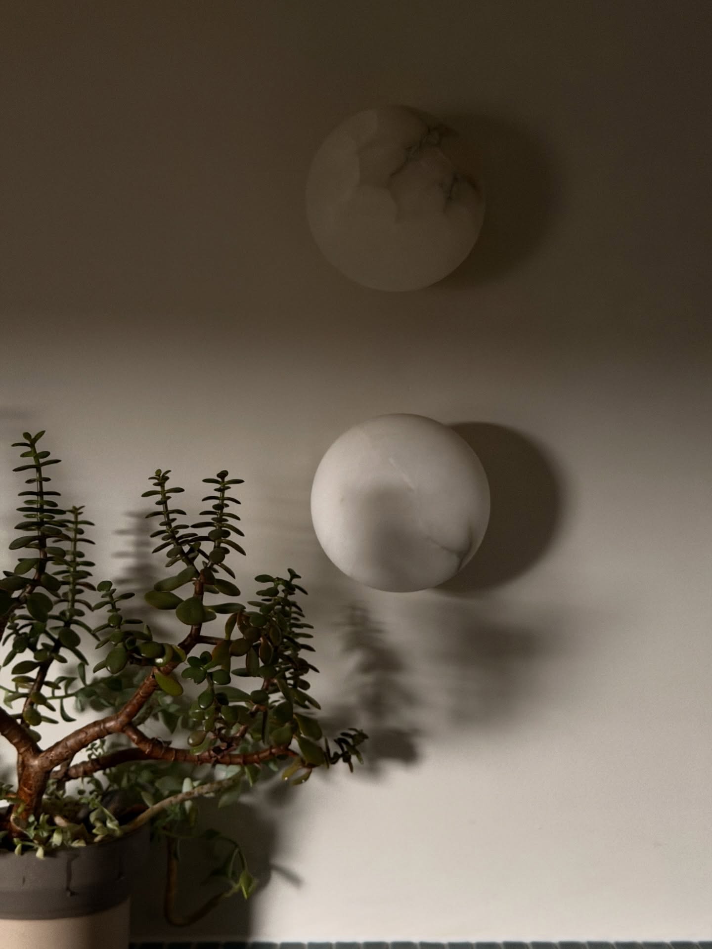 Swipe to see how thoughtful lighting turns this Pen y Lan space into a calm, crafted backdrop for everyday living.