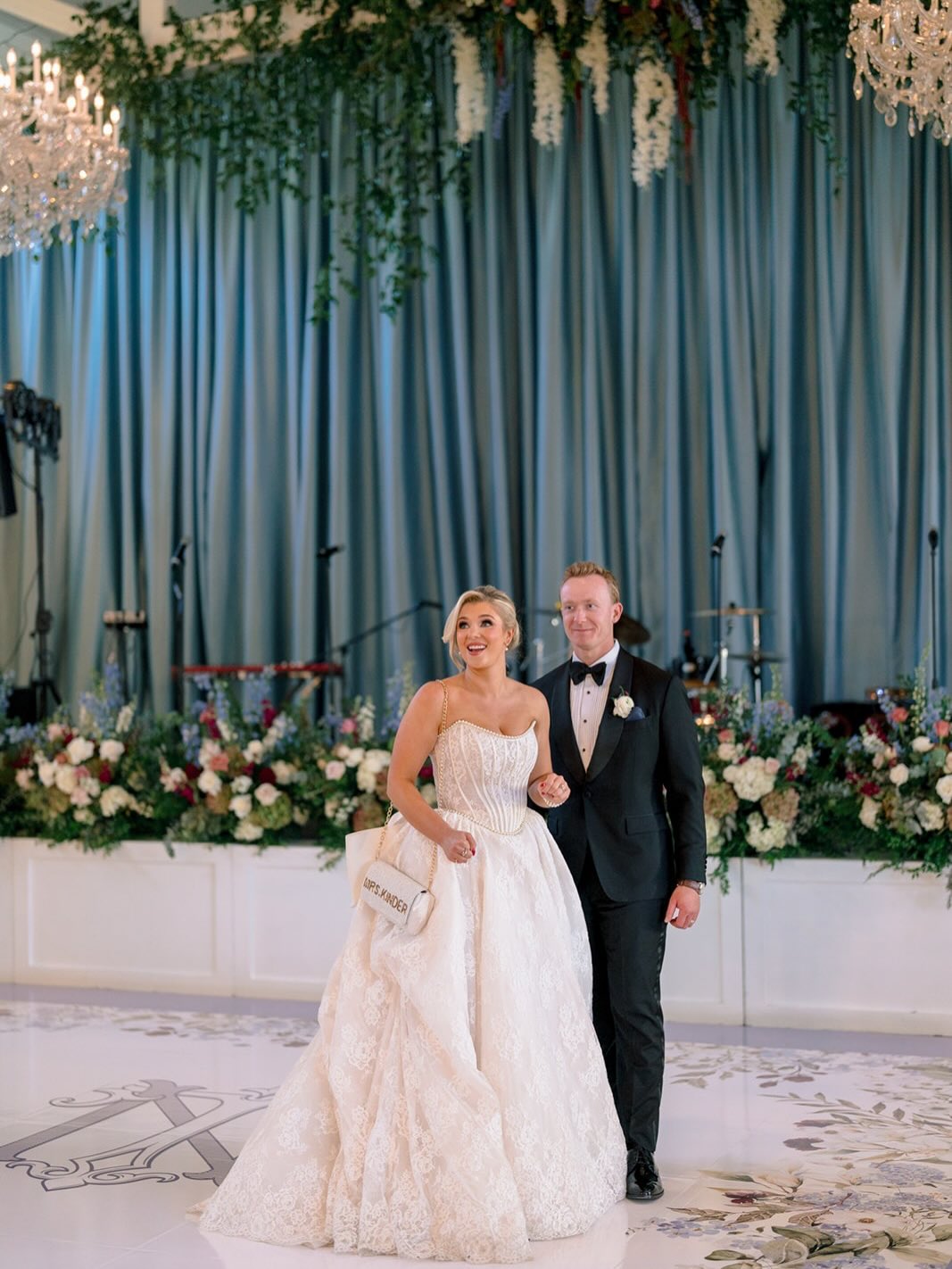 When your ‘something blue’ is show-stopping drapery that sets the scene for every memory at your reception. Taylor + Nick’s wedding reception proves that the right backdrop elevates everything!
Photographer: @wyethaugustine
Planning & Design: @sohoeventdesign
Florals: @weddingswithbarbara
Draping: @partytables_linensanddrapery
Specialty Furniture: @marthamydearrentals
Linens: @stradleydavidson | @reverie_social | @theonicollection
Tabletop Rentals: @emersonjamesrental
Tables & Stage: @curatedeventscharlotte
Stationery: @virilovelydesigns
Dance Floor Wrap: @carolinaeventwraps
Ice Sculpture: @artisanicesculptures
Wedding Cake & Cookies: @mariannetayloecake
Chandeliers: @knottyartisans
Ceremony Arch: @oxumeventdesign
Band: @eastcoastentertainment | Black & Blue Experience
Ceremony Sound: @splitsecondsound
Beauty: @holteavery
Tans: @avalonsunlessbeauty
Wedding Gown: @klienfeldbridal | @pninatornai
Pet Handler: @fureverfriendsclt
Transportation: @carolinaclassiccarrentals
Venue: @trumpgolfcharlotte
Videography: @davidsonfilmco
#WeddingWednesday #EventDecor #EventDrapery #WeddingDrapery #CustomDrapery