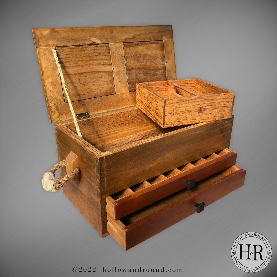 Designed for carving knives and supplies, this custom tool box features two drawers and a removable & portable storage tray. Not pictured are the hand cut initial inlays on the lid panels. Tied rope make perfect handles for transporting.
