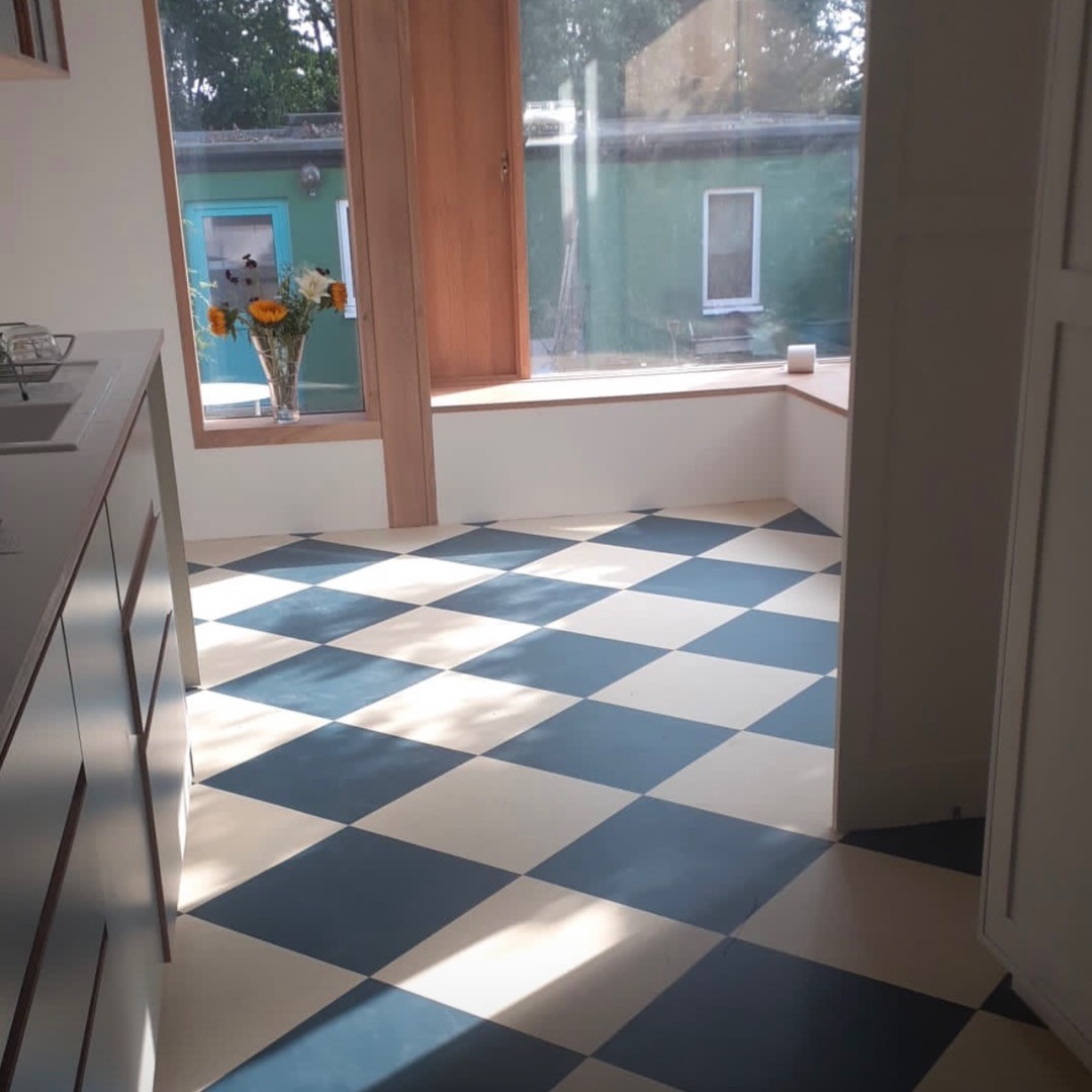 Practical and stylish, Marmoleum Floor Tiles creating a beautiful design effect in kitchen.