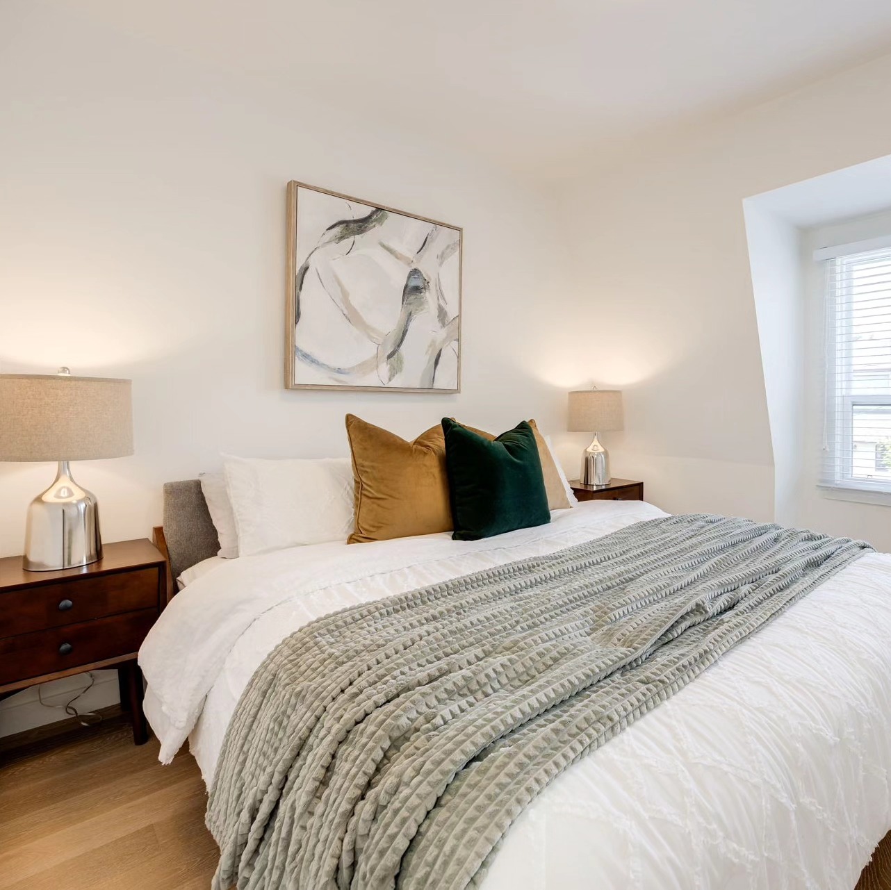 Perfect example of "less is more". Staged and sold in days!! #greygreen #torontostaging #torontorealestate #serenitynow #primarybedroominspo #woodandchrome #neutralvibes #bedroomdecor #cognacaccents #tosspillows