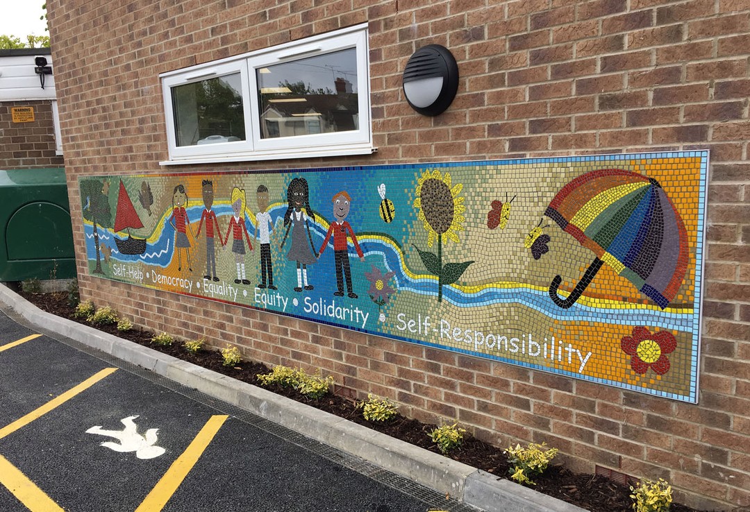 Created with the pupils of Thameside Primary School, This design includes drawings from the students and really does brighten up the entrance wall. Including the schools 6 values this is a really welcoming addition to the school.
#school #ukschools #schoolproject #schoolentrance #schoolarchitecture #schoolmural #glassmosaic #mosaicinspiration