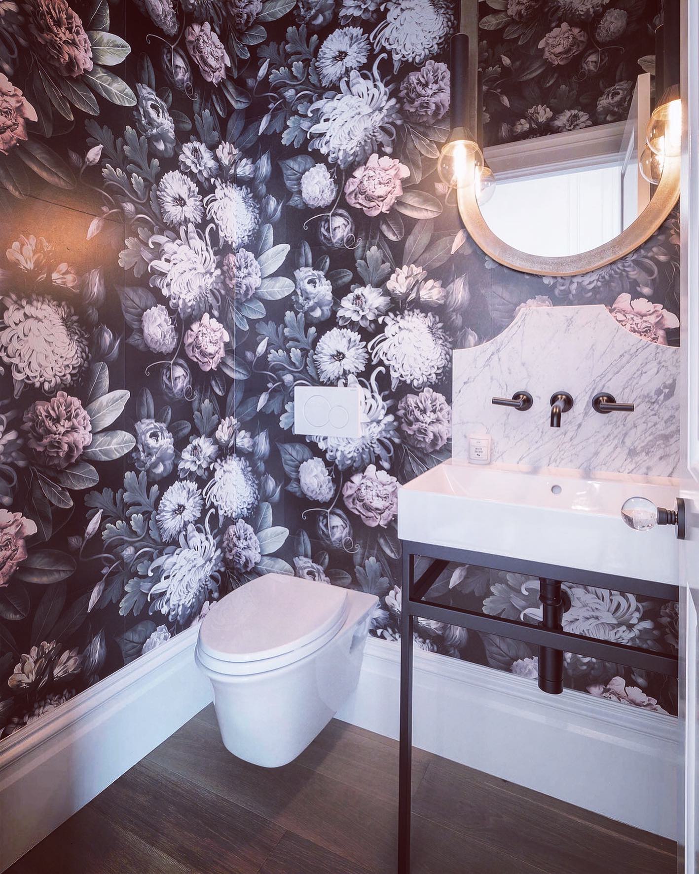 Modern gothic powder bath for this Halloween weekend. We were happy to work with @merylandmiller on this beauty. #victorian #wallpaper @lacavadesigns @brizofaucet @totousa