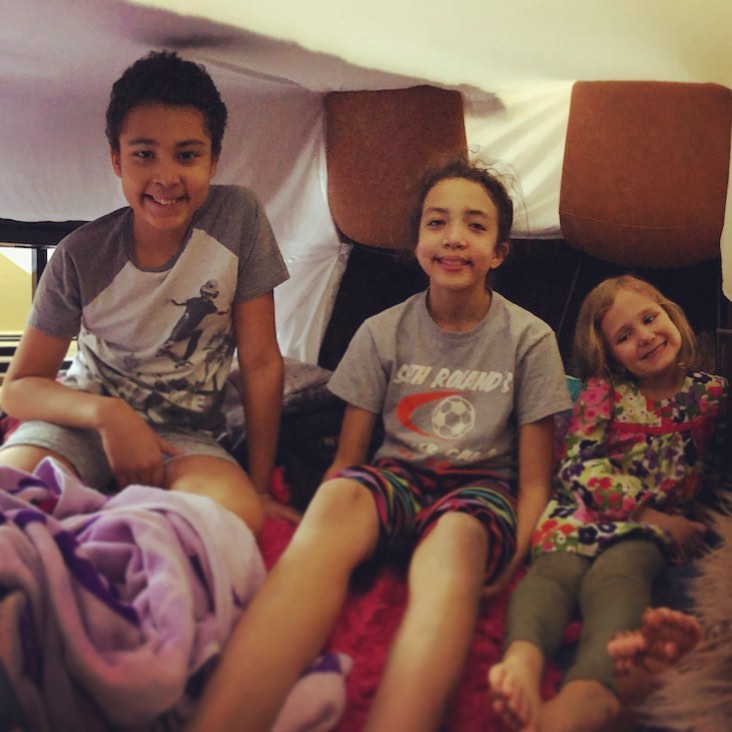 Real Kids try indoor glamping! Try the Real Kids Fort Building Challenge at www.realkidsplay.com for a fun indoor activity that all the kids in the house can enjoy! Even though challenges are specifically designed for 3rd graders, brothers and sisters of all ages can join in on the fun! #camping #glamping #indoor #indoorcamping #indoorglamping #fortbuilding #siblings #together #ageless #classic #homeschool #homeprojects #pillowfort #realkidsplay #3rdgrade