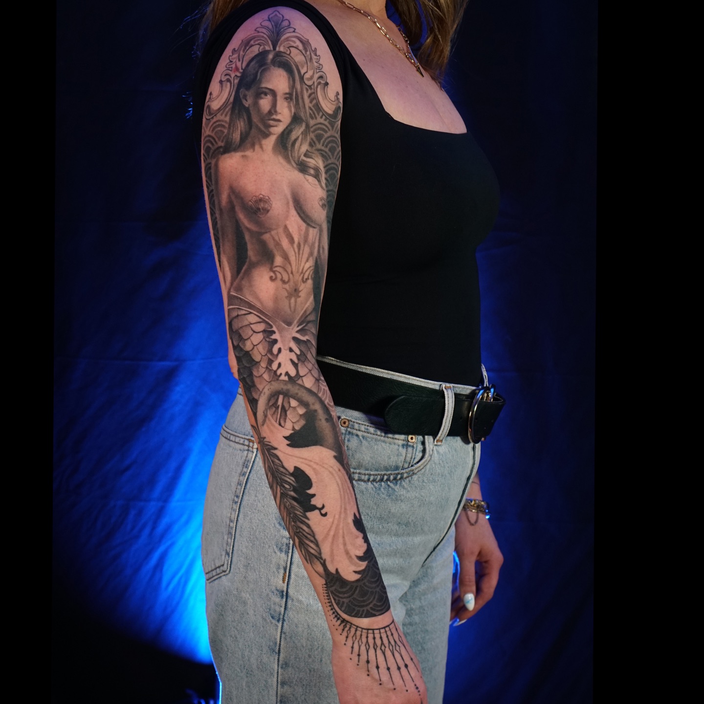 This is where proportions matter. When you see tattoos on your phone, everything looks small. You’re not thinking about how big that tattoo actually is on a real body part. You just see “mermaid” and assume it can be done smaller.
But a full figure needs space. Head, body, arms, tail. The more you zoom out on a figure, the more room you need. There’s a limit to how small anatomy and detail can go and still heal properly and hold over time.
So for those of you wanting full body figures, just remember you need a lot more real estate to pull it off.