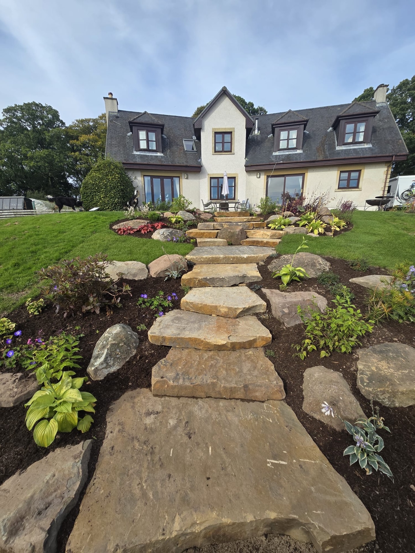 Happy Friday everyone 🌱 We’re showcasing a garden designed to belong exactly where it sits 🌿
Special attention was given to the slabby sandstone from @cedstonelandscape which we carefully tied in with reused and recycled paving for the patio areas.
By blending new stone with reclaimed materials, we’ve created a seamless link between the countryside views, surrounding landscape, and this beautiful rural property in Stirlingshire.
Thoughtful design by our in-house designer and project manager Keith McSherry. Natural materials. Built to last.
#GardenDesign #LandscapeDesign #Sandstone #CEDStone #ReclaimedPaving SustainableLandscaping RuralLiving Stirlingshire OutdoorSpaces BuiltToBelong