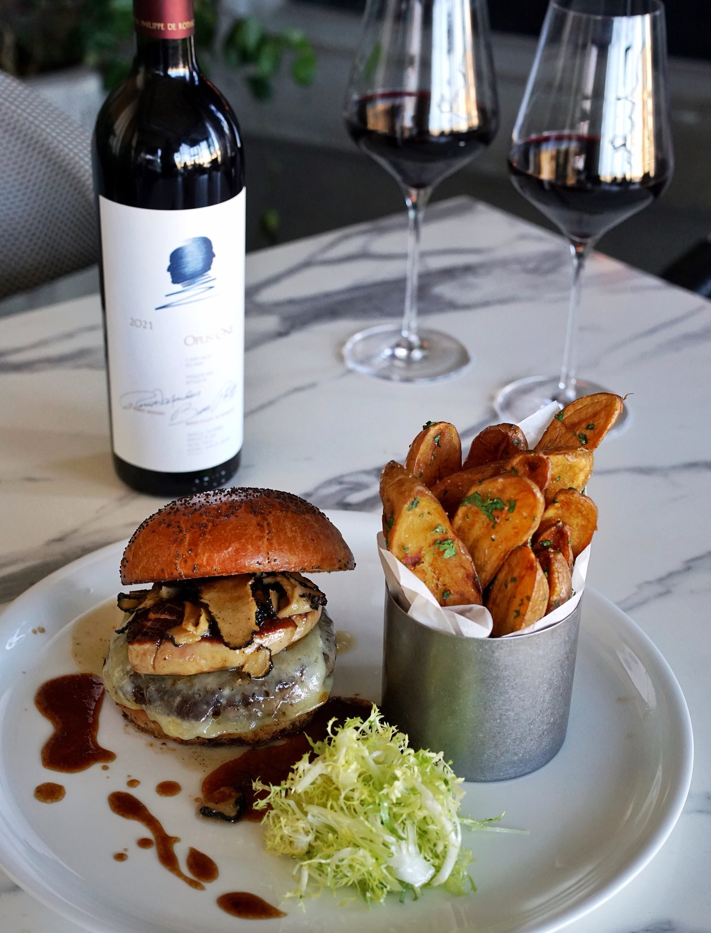 Introducing our ‘HK Burger’ - a new addition to our dinner menu that’s truly close to our chef’s heart.
Named in honour of Chef & DJ Hubert Keller @chefhkeller who inspired Chef Lupe’s @cheflupeavilalv culinary journey. This burger tells a story of passion, mentorship, and love for great food. Enjoy this special creation paired with a bottle of Opus One for an extraordinary dining experience.