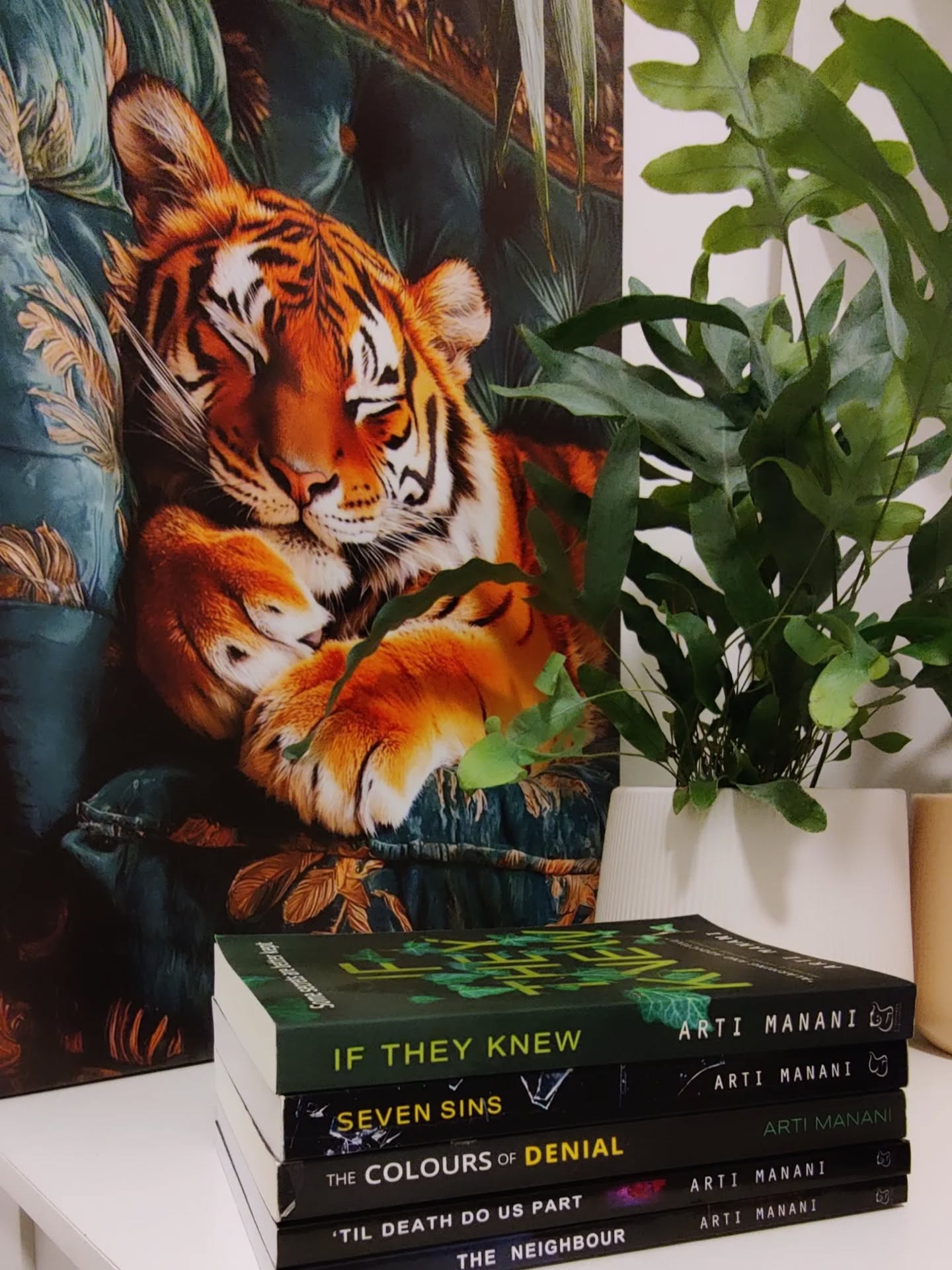 All of my obsessions in one pic. Writing, books, plants, and a (slightly concerning) love for big cats. Will I ever get over it? Highly unlikely. 🦁🐯🖤
