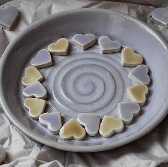 Wedding Dish - wheel-thrown in white stoneware, glazed in blue/lavender zircon glaze. Dish filled with handmade porcelain hearts, glazed in honey & lavender clear base glaze.