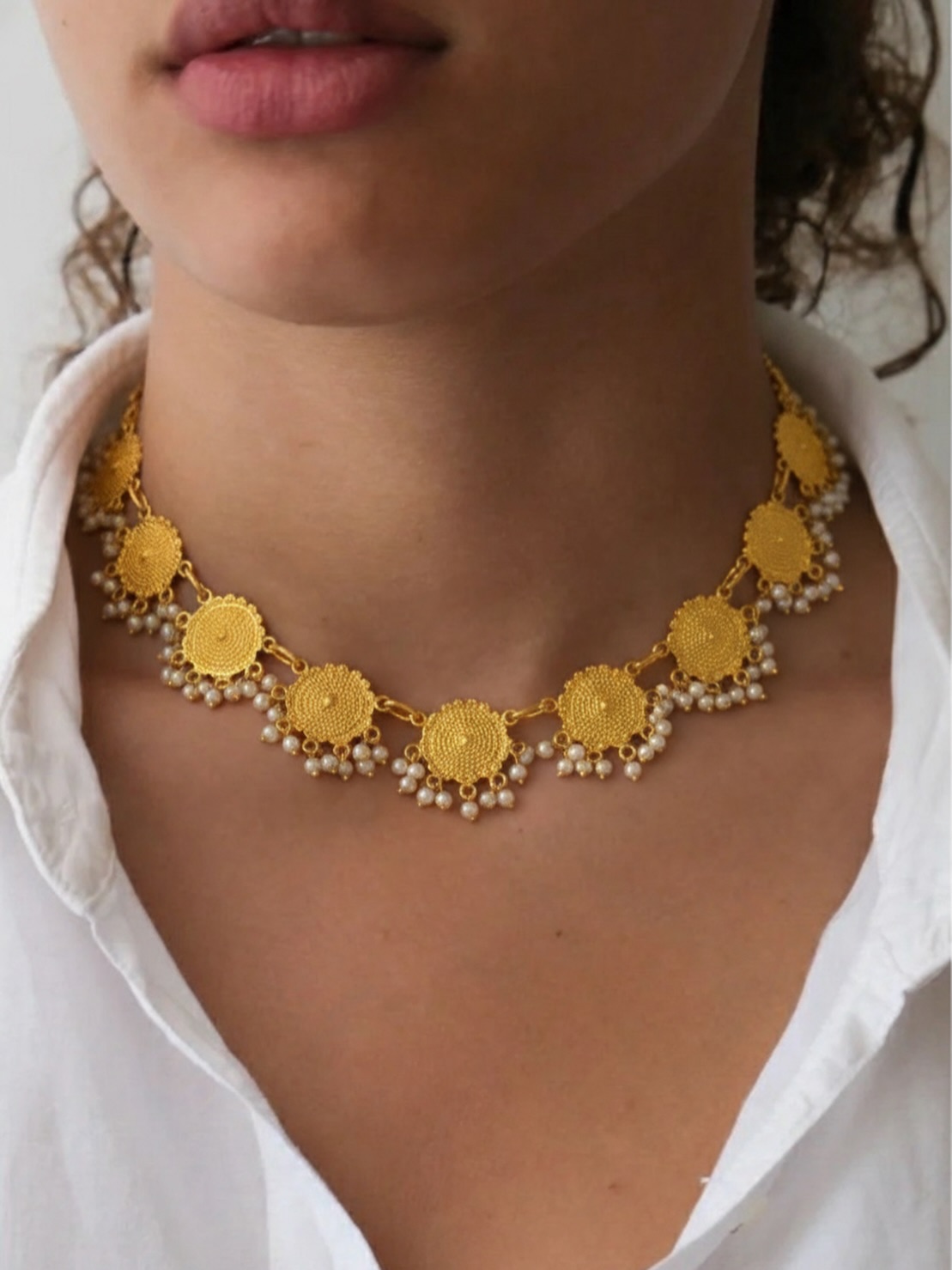 Our Sun-Drenched Filigree Choker combines the intricate heritage of ancient craftsmanship with a modern, effortless silhouette. Featuring handcrafted gold-dipped discs and delicate seed pearl droplets, it’s designed to sit perfectly against the collarbone - adding just the right amount of “glow” to a crisp white shirt or your favorite evening dress.
Why you’ll love it:
• Versatile Luxury: Bold enough to stand alone, refined enough for daily wear.
• Heritage Reimagined: Inspired by traditional motifs, polished for the modern woman.
• The Perfect Weight: Designed for comfort that lasts all day (and night).
Stop waiting for a “special occasion” to wear your best jewelry. Make today the occasion. 🥂
#JewelryAddict #ModernHeritage #ChokerStyle #EffortlessElegance #GoldJewelry
StatementNecklace
OOTD
Atrangibykritika
