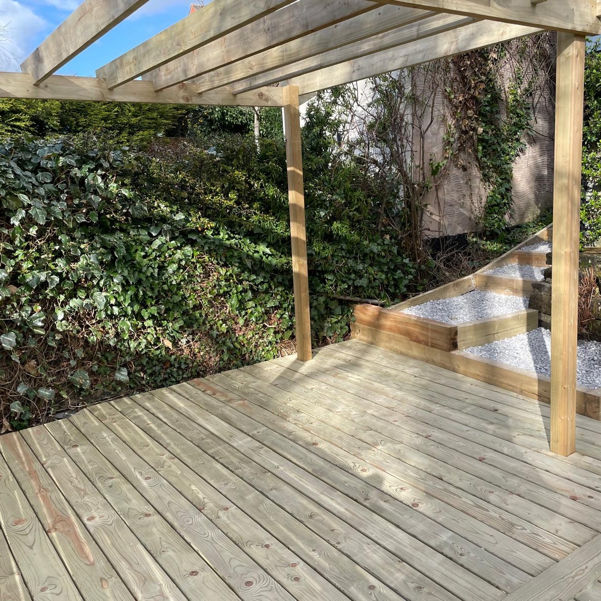 You can still create great space in Smaller gardens which are on multiple levels. Take a look at this stunning sloping garden with a customer deck following the curve of the garden