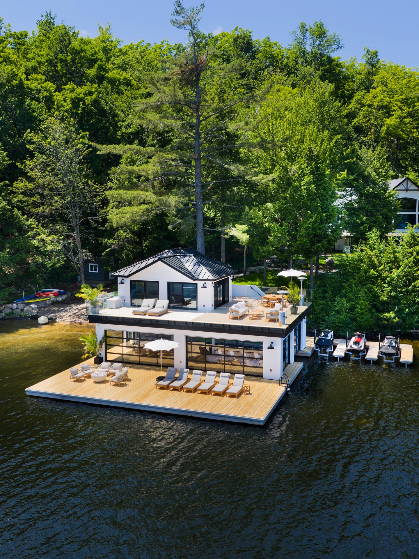 Modern architecture meets Muskoka’s natural beauty in this custom-built boathouse
#boathouse #lakesideluxury #custombuilt
This custom-built boathouse on Lake Muskoka features two upper-floor bedrooms, a full kitchenette, indoor and outdoor lounge areas, and glass railings that open up to stunning lake views. With jet ski slips and a spacious dock, it’s built for relaxing, entertaining, and soaking up every summer moment.
Follow @pattymacbuilt for more home & cottage inspiration!
Follow @spencerdouglasmuskoka for more design content and inspiration.
.
.
.
Construction by @pattymacbuilt
Design by @spencerdouglasmuskoka
The team involved:
Cape Cod: @centurymilllumber
Exterior/interior finishing: @muskokalumber
Steel Dock: @coulsonbros
Siding Materials: @weismillertimbermart
Boatlift: @sunsetdocksmuskoka
HVAC: @smhomecomfort
Glass Railing: @muskokify
Garage Doors: @mapledoors
Electrical: @ampproelectric
Roofing: @advancedroofing_sheetmetal