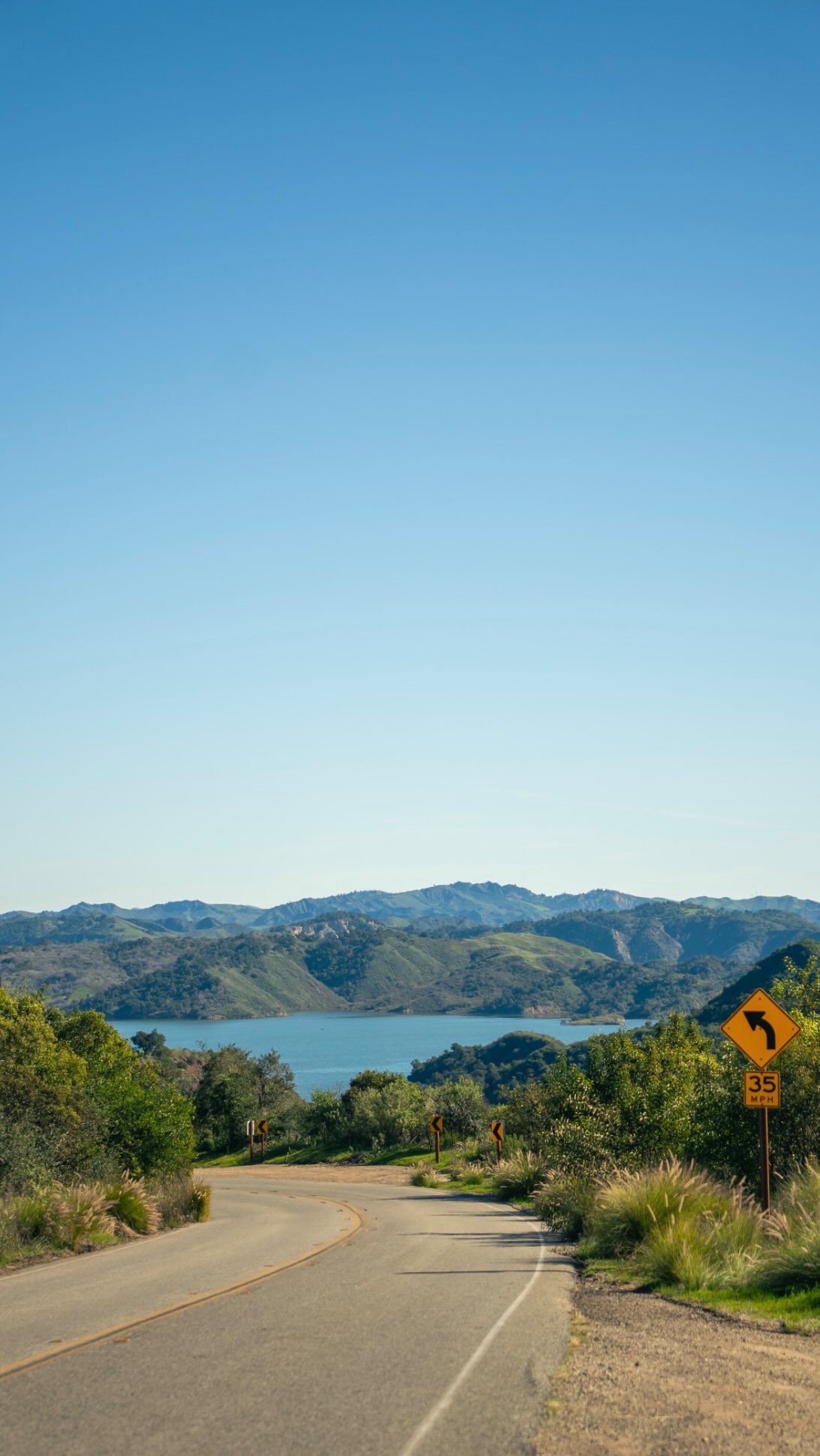 ’Awha’y -> Rancho Ojay -> Nordhoff -> Ojai
Archaeological evidence shows the Chumash people have called this region home for over 13,000 years. Anthropologists refer to this specific group as the Ventureño Chumash (a name given by outsiders due to their proximity to the Ventura Mission), though they identified themselves by their specific village lineages.
While there were several villages throughout the valley, one specific village in the Upper Valley, ’Awha’y, is the root of the modern city name.
According to linguists and Chumash elders, ’Awha’y translates to Moon. (The popular idea that it means “The Nest” was actually a marketing myth invented by tourism promoters in the early 1900s).
In 1782, Spanish missionaries arrived on the coast. The Mission system systematically dismantled the inland villages, removing the people from their land and forcing them into labor at the Mission.
After Mexico won independence from Spain, the land was granted to a businessman named Fernando Tico in 1837. He named it Rancho Ojay, creating the first phonetic bridge from the indigenous ’Awha’y.
Tico eventually sold the land to Pennsylvania oil investors. They bought it for the “black gold,” but the technology wasn’t advanced enough to extract the thick crude efficiently, so the boom went bust.
In 1874, the developers laid out a town grid. They named it Nordhoff after Charles Nordhoff, a famous author whose books urged Easterners to move to California for their health.
However, during World War I, rising anti-German sentiment made the name “Nordhoff” a liability. In 1917, the town underwent a total transformation and was renamed Ojai, finally reclaiming the anglicized version of the original name.
Ojai was officially incorporated as a city in 1921.
The town changed its name, but the local High School didn’t. It’s still called Nordhoff High, and the reason there’s a giant “N” on the mountainside today.
Sources:
The Barbareño/Ventureño Band of Mission Indians
Ojai: A Postcard History by Richard Hoye
The Chumash Indians of Southern California by Leif C. W. Landberg
Oil, Orchards and Flames (History of Ventura County)
ojaihistory.com