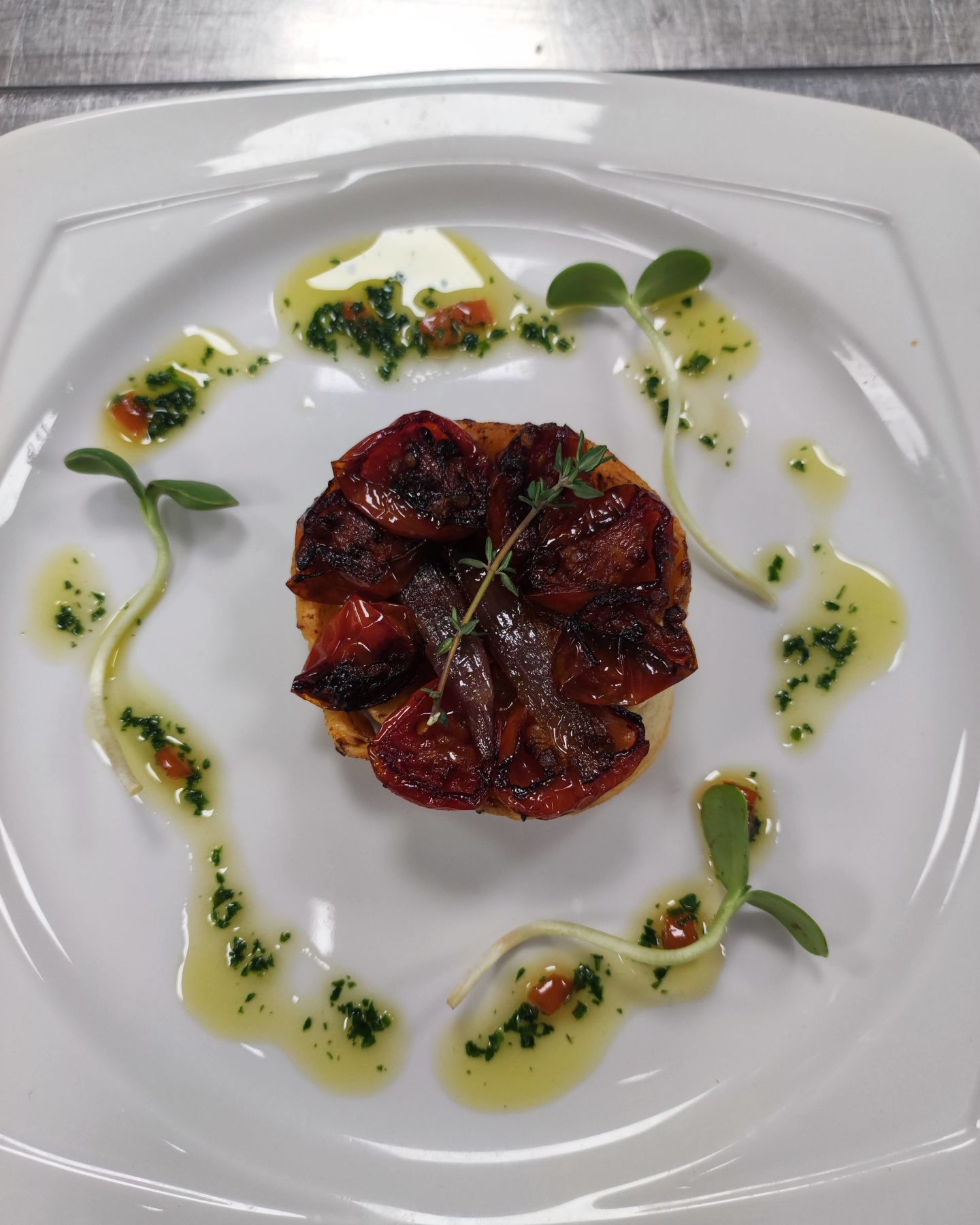 Confit cherry tomato tarte tatin with caramelised shallots and sauce vierge, delight everyone. #vegan #yorkcaterer #goodfood #dairyfree