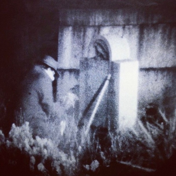 Only known photograph of The Poe Toaster - a mysterious stranger who, from the 1930s through 2010, would leave three roses and a bottle of cognac on Edgar Allan Poe's grave every year on the anniversary of author's birthday (January 19, 1809). This photo appeared in a 1990 issue of Life Magazine. The spectral visitor has since abandoned its haunt and the tradition has been replaced by a less spooky and more family friendly tourism event.