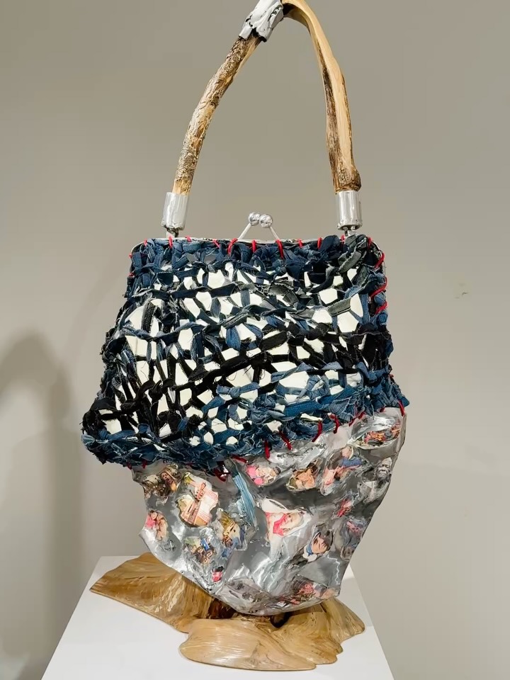 I am honored to be a part of this year’s Certain Women Art Show, (@certainwomenartshow)“Brave Like Eve,” that opened this month at the @bountifuldavisartcenter
The work I created is a large bag that symbolizes all that Eve carried with her out of the Garden.
It is made of aluminum, knit reclaimed jeans, wood, images transferred into banana fiber paper, and LED lights.
The work is titled, “What She Carried out of Eden.”
Here is the poem I wrote for my artist’s statement:
What She Carried Out of Eden
Bare feet pressing into trembling soil
a world newly awake.
If this is falling
it feels somehow graceful.
Though that fruit was forbidden—
it was urgent, unrelenting; desirable.
A pulse of knowing,
a light that could not be unseen.
She bit, and the air changed shape.
Behind her, the garden sighed
and closed its gates of ease.
Before her, a horizon unfolded—
wild, uncertain, infinite.
She carried a bag made of beginnings,
stitched from the fabric of courage.
Woven from her dreams and genes.
Out of it spilled the faces of women—
a thousand, a billion—
each one luminous with the inheritance of that moment.
One laughs with the bliss of discovery.
One weeps for what feels like an ending.
One clenches her fists in fury.
One holds a newborn up to her face,
eyes wide with both terror and tenderness.
We were all there,
in the sack she slung across her shoulder—
the burden and the blessing
she carried forth in her body, pressing on her heart.
And with each step out of Eden
She rose.
She climbed into ache and wonder,
into birth and burial,
into creation itself.
And the world
holding its breath for her
rose to the surface, gasped… and panted.
And finally knew what it means to be alive.
#certainwomenartshow #bountifuldavisartcenter #adamandeve #eveknewwhatshewasdoing #aluminumsculpture