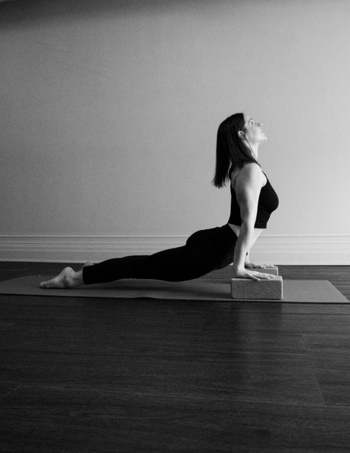 UPWARD FACING DOG — Urdhva Mukha Svanasana
In Sanskrit, urdhva means “upward,” mukha means “face,” and svana means “dog.” This posture invites the heart forward and up — a shape of openness, strength, and receptive courage.
Upward Facing Dog is an energizing backbend that asks for both effort and spaciousness. It’s not about how high you lift, but how evenly you distribute the work through the whole body.
Urdhva Mukha Svanasana strengthens the arms, shoulders, wrists, back body, and legs while deeply opening the chest, lungs, abdomen, and hip flexors. The thighs lift away from the floor, creating an active, supported backbend rather than a passive drop into the low back.
Placing blocks under the hands can be incredibly supportive here. The added height creates more space between the floor and the torso, helping you:
• reduce compression in the low back
• access more length through the front body
• find better shoulder alignment over wrists
• make the posture more accessible if you feel “stuck” close to the ground
This small lift often allows the pose to feel lighter, more spacious, and more sustainable in the spine.
This pose builds confidence and clarity. It teaches us how to be strong without hardening, open without collapsing. There is alertness here, but also lift — a reminder that heart-opening requires both grounding and courage.
Reflect on this the next time you press into your hands and lift your heart forward.
.
📸 @candice.ferreira
.
.
.
.
.
.
#upwardfacingdog #asana #yoga #yogapractice #yogaasanas