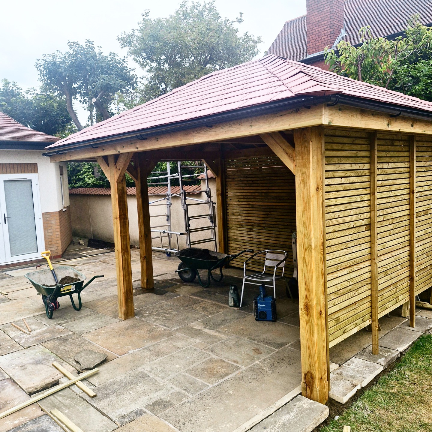 On this project, our customer wanted to reuse their existing Yorkshire stone flags with a customer-built pergola,