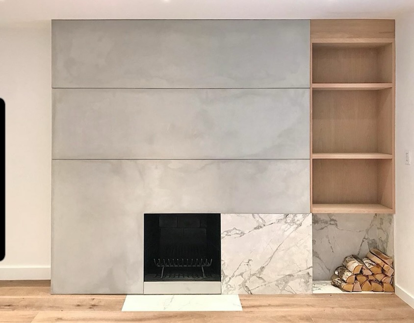 This custom fireplace feature wall was designed as a true focal point—layering hand-cast concrete with natural marble and warm oak to create depth, balance, and quiet drama. Each material was chosen for how it complements the next: concrete for its grounded, sculptural presence, marble for contrast and movement, and oak to soften the composition and bring warmth into the space. A timeless mix of textures designed to feel architectural, intentional, and lived-in.
.
#CustomFireplace
#ConcreteDesign
#InteriorArchitecture
#LuxuryInteriors
#modernfireplace