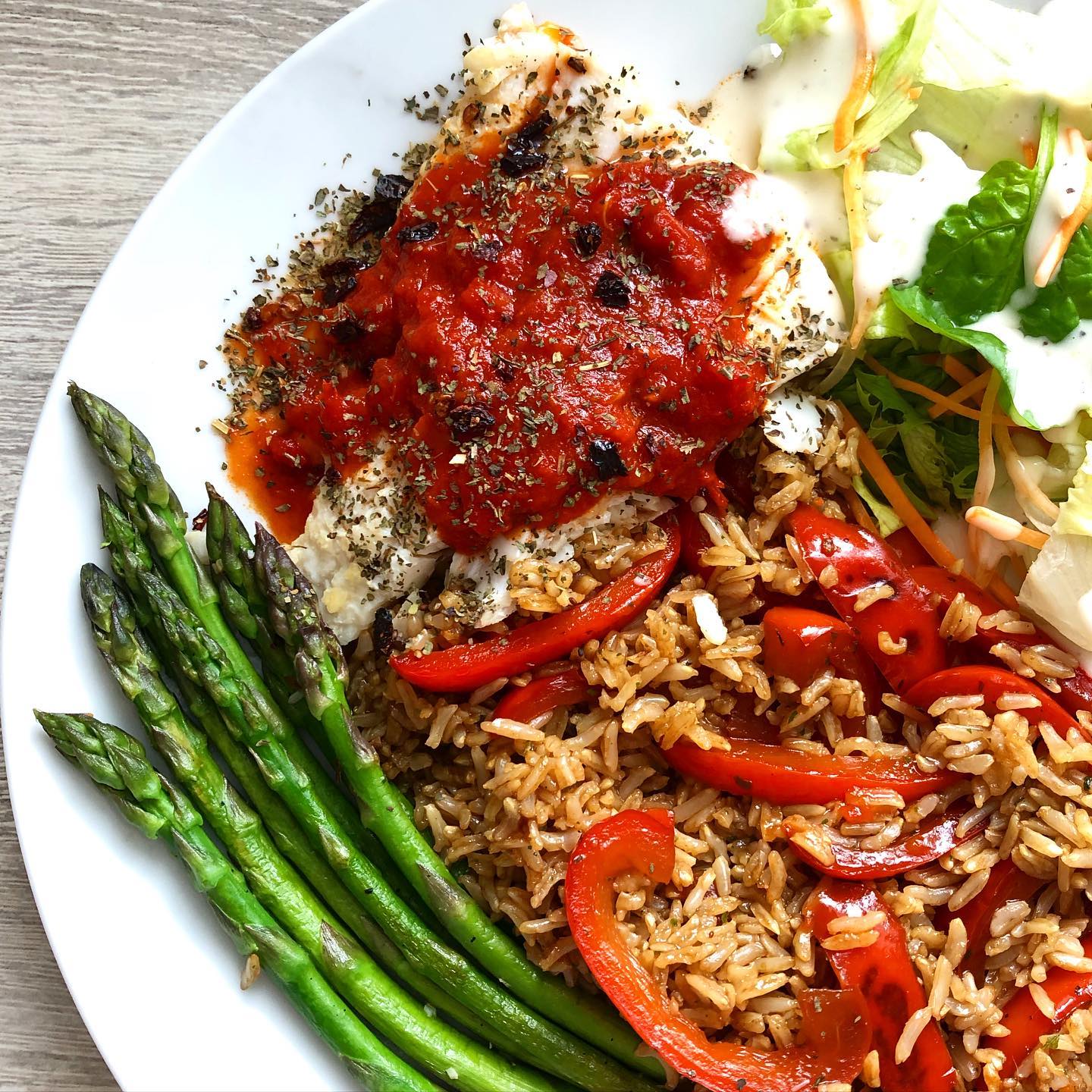 Tomato, chilli and basil topped pan fried cod with pepper fried rice and asparagus 🍅