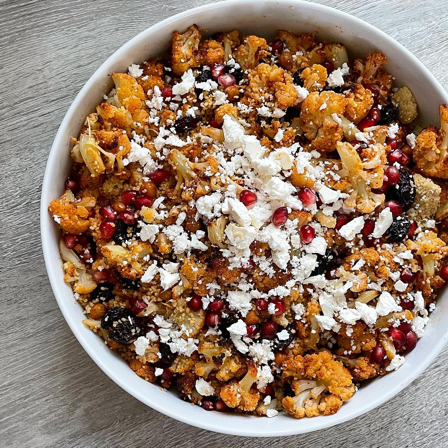 Baked jerk cauliflower, crispy chickpeas, couscous, sultanas, pomegranate and feta ✨