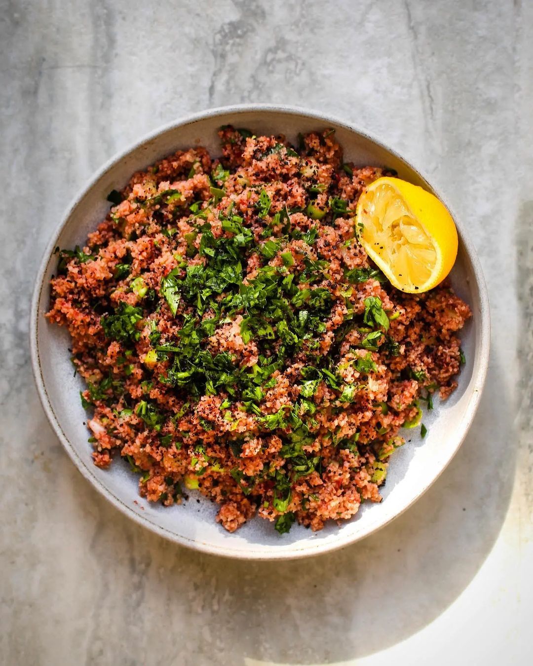 #Reposted from @wooptonight Spicy bulgur salad with tomato, urfa chilli and sour cherries 🍒
Last one from Civan Er’s trio of recipes published in @guardianfeast
This is a bulgur salad called “kısır” where fine bulgur is soaked in a mixture of sour cherries, tomatoes and cold water. I’ve cheated and soaked bulgur in hot water to reduce the preparation time and later mixed with a sour cherry and tomato sauce that is made by blitzing a beef tomato and sour cherries in a blender. I used frozen sour cherries from my local Polish shop and only used half the sauce. Once the bulgur is prepared chopped herbs, cucumbers and chilies are added to it along with pomegranate molasses, spices and lemon juice. I used tangy Cornedor pomegranate molasses that @cornedor.co #gifted me.
I made this for lunch and I made a packed lunch with leftovers to eat on our flight to Bodrum, best airplane food!
🇹🇷 Vişneli 🍒kısır
Civan Er'in @guardianfeast'te yayınlanan üç tarifinden en son denediğim tarif.
İnce bulgurun vişne, domates ve soğuk su karışımında uzun süre ıslatılarak yapılan bir tarif. Hazırlama süresini kısaltmak için tariften farklı olarak bulguru önce sıcak suda beklettim ve daha sonra bir blenderdan çektiğim domates ve vişne sosuyla karıştırdım. Dondurulmuş vişne kullandım. Bulgur bu şekilde hazırladıktan sonra yeşillikler, salatalık, aci biber ile birlikte nar ekşisi, baharatlar ve limon suyu ekledim. @cornedor.co 'un bana hediye ettiği Cornedor nar ekşisini kullandım. Kısırı Londradaki son günümüzde öğle yemeği için yaptım artanları da Bodrum uçağımızda yemek için saklama kabında yanıma aldım, çok iyi bir uçak yemeği oldu!
#kısır #bulgur #bulgursalad #sourcherry #vişnelikısır
#vişne
@pinkladyappleuk
@foodphotoaward #pinkladysnapsJul22
#mattinwoodmasterclass
#f52grams #f52community
#thefeedfeed @thefeedfeed
#foodblogphoto#beautifulcuisines #pomegranatemollases
#pomegranatemolasses