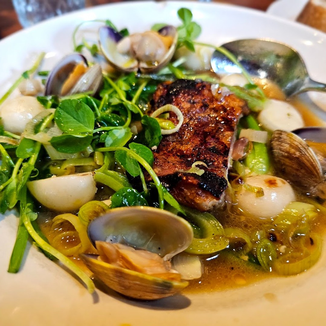 Watershed in Mill Valley. Crispy Pork Belly Soup with Manila clams, baby turnips and their greens, spring onions, fava greens, and a rich prosciutto broth.