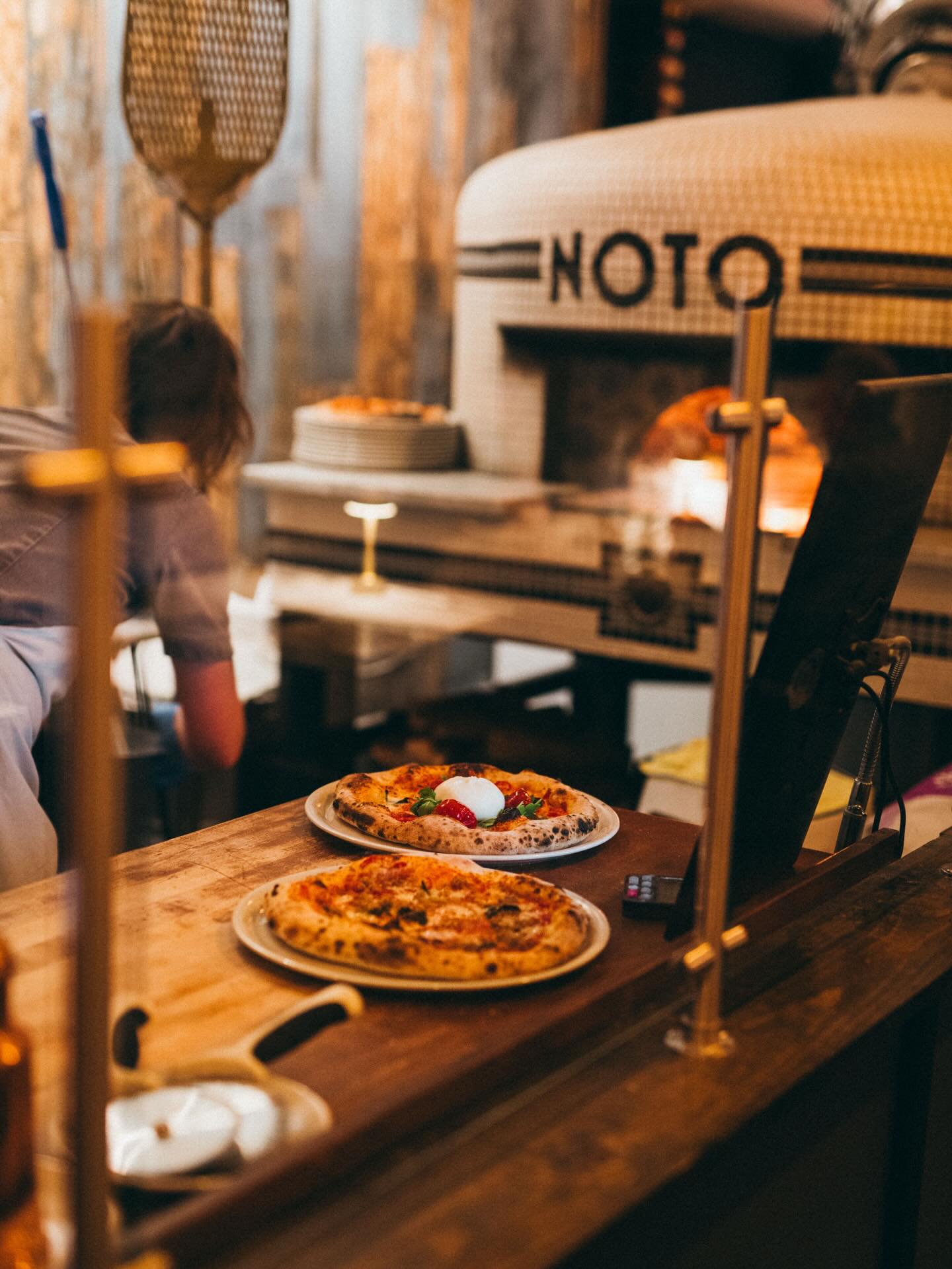 Pizza Napoletana at Noto.
VPN Certification #974
VPN stands for Verace Pizza Napoletana (âTrue Neapolitan Pizzaâ).
The Associazione Verace Pizza Napoletana (AVPN) is the official governing body, founded in Naples in 1984, that protects and regulates the tradition.
As a restaurant that is VPN-certified, we must follow strict standards, including:
Dough & Ingredients
⢠Approved Italian ingredients
⢠Specific hydration, salt, and yeast ratios
⢠No fats or sugars added to the dough
⢠Hand-stretched dough only
Fermentation
⢠Controlled fermentation times (often 48+ hours)
⢠Focus on dough maturity and digestibility
Pizza Making
⢠Dough balls formed by hand
⢠Topped in a precise order
⢠Baked directly on the oven floor
Oven & Baking
⢠Wood-fired oven only
⢠Certified oven design
⢠Bake time under 90 seconds at oven temperatures of 1000 degrees
Training & Inspection
⢠Restaurants are inspected before certification and subject to standards afterward
Why VPN Certification Matters
⢠It guarantees authenticity, not just style
⢠It preserves centuries-old Neapolitan tradition
⢠It signals craftsmanship, discipline, and respect for ingredients
@vpnamericas #pizzanapoletana