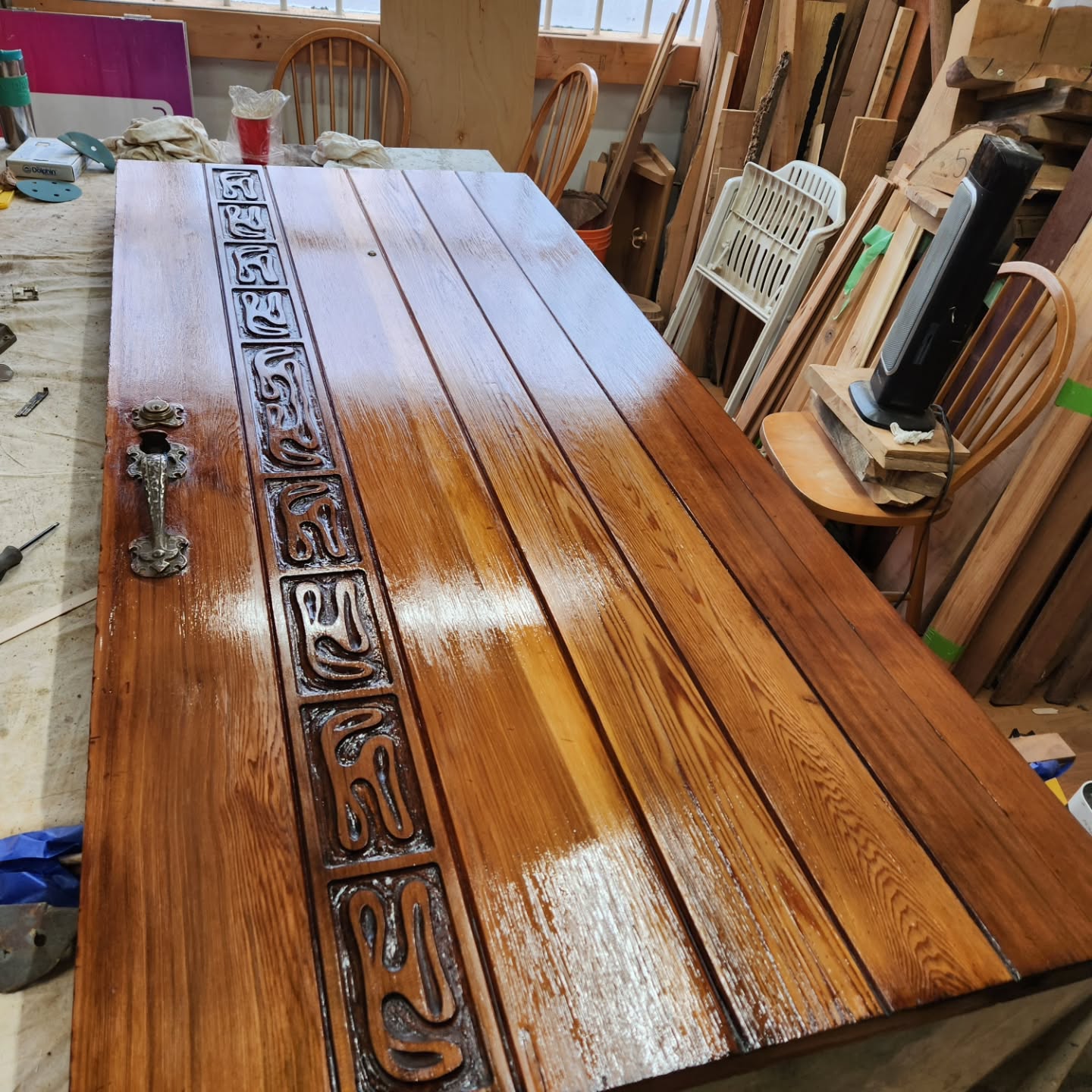 A door repair and refinishing. For a one of .kind 100 year old door