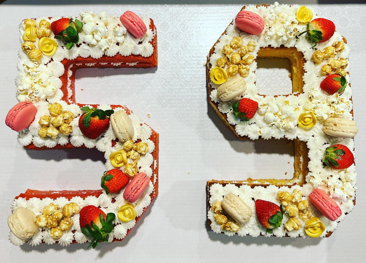 New Year BIRTHday. Strawberry Cake and Vanilla Kake with buttercream icing decorated with popcorn, macarons, strawberries and flowers. Thanks for your support!! #buythepoundkakes #birthdaycake #missouricity #sugarlandtexas