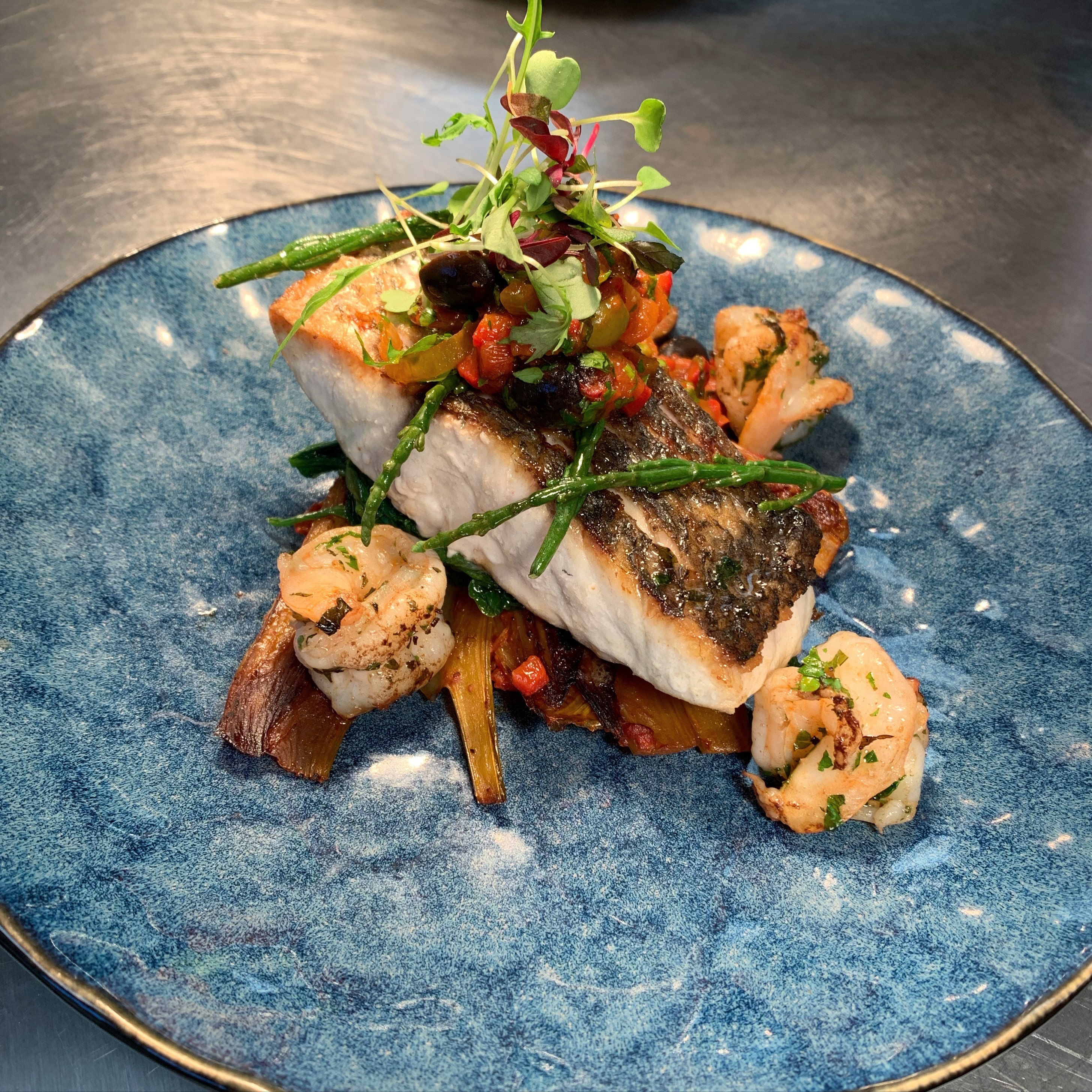 Our first special! A pan fried stone bass fillet and charred king prawns, braised fennel, chilli and olive ragu, crushed new potatoes and samphire👌🏻