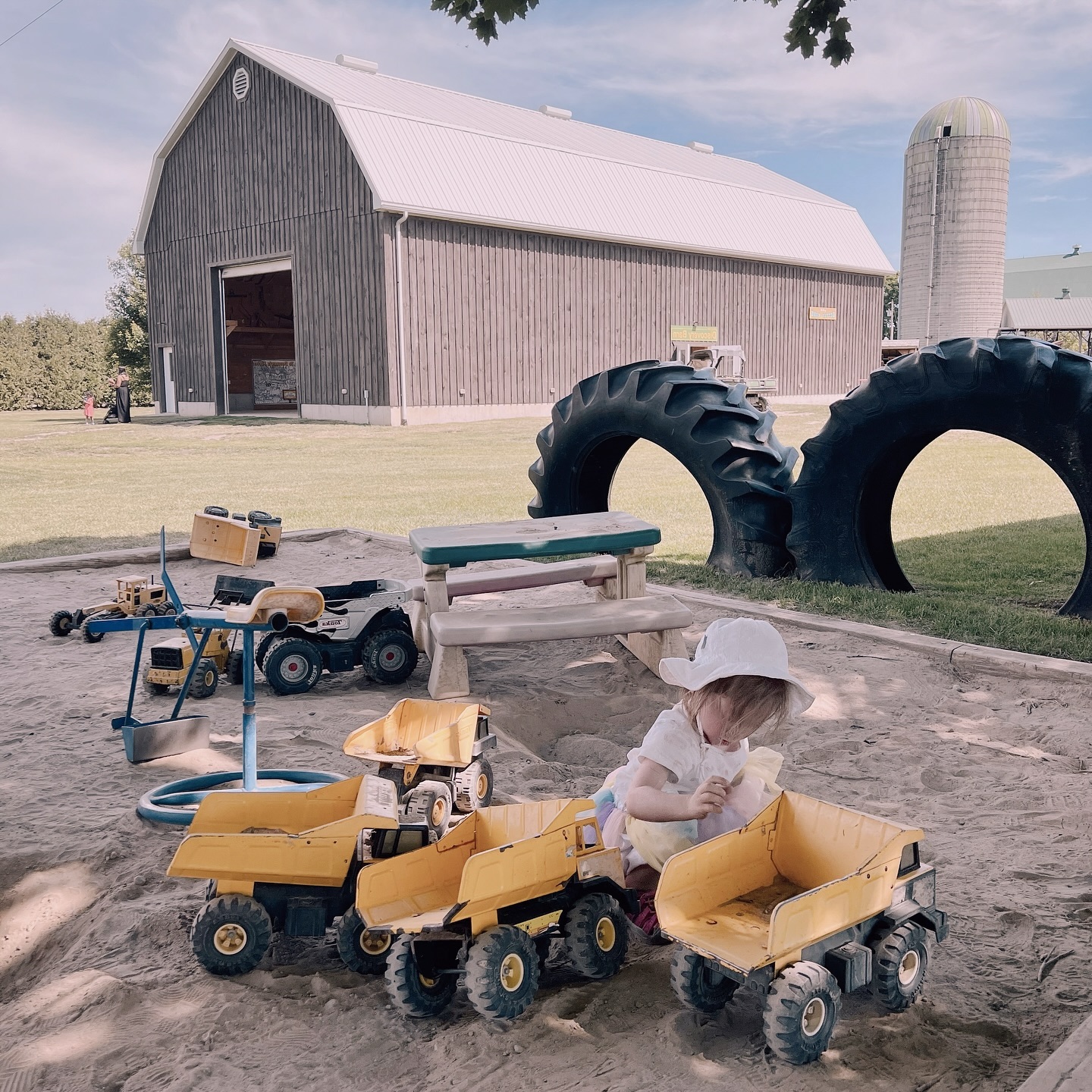 Nothing quite like a classic barn as a backdrop for playtime. #homegrowntomatoes #daysonthefarm #farmplayareas #farmactivities #childcare #nanny #nannyshare #daycare #torontobeachesdaycare #homedaycare