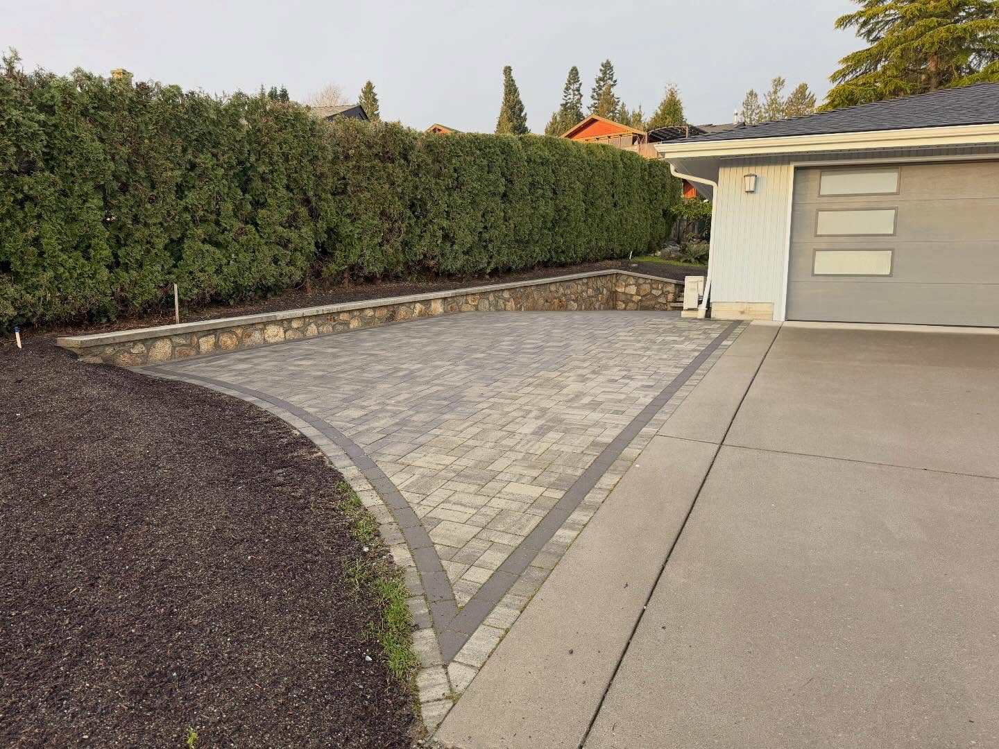Beautiful pavers and rock wall work.