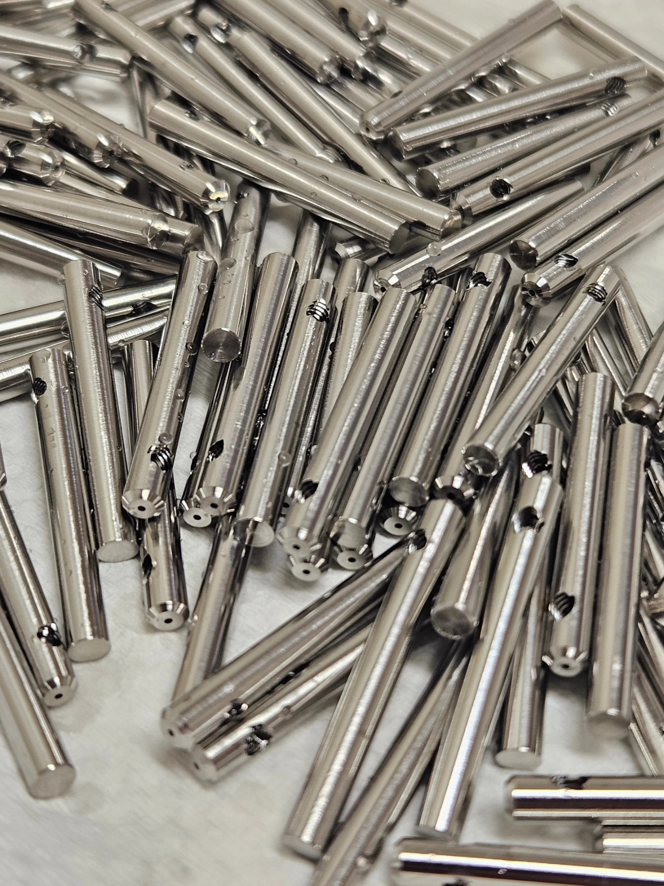 Big boy parts on the citizen R04. I'd say that this is basically the max size for to this machine, 3mm OD, 26mm length. C could make some large OD parts, and slightly longer, but that's like taking a Ferrari off roading.
Tricky 0.5mm hole, approx 20xD...