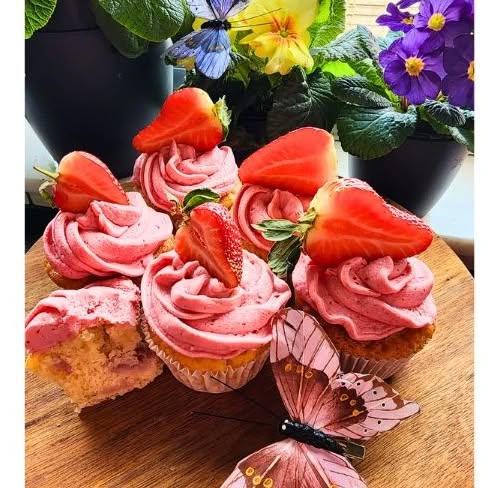 Our fresh strawberry cupcakes are a delectable combination of fluffy vanilla cake infused with chunks of juicy, ripe strawberries, topped with a swirl of creamy strawberry frosting and a fresh, plump strawberry on top.