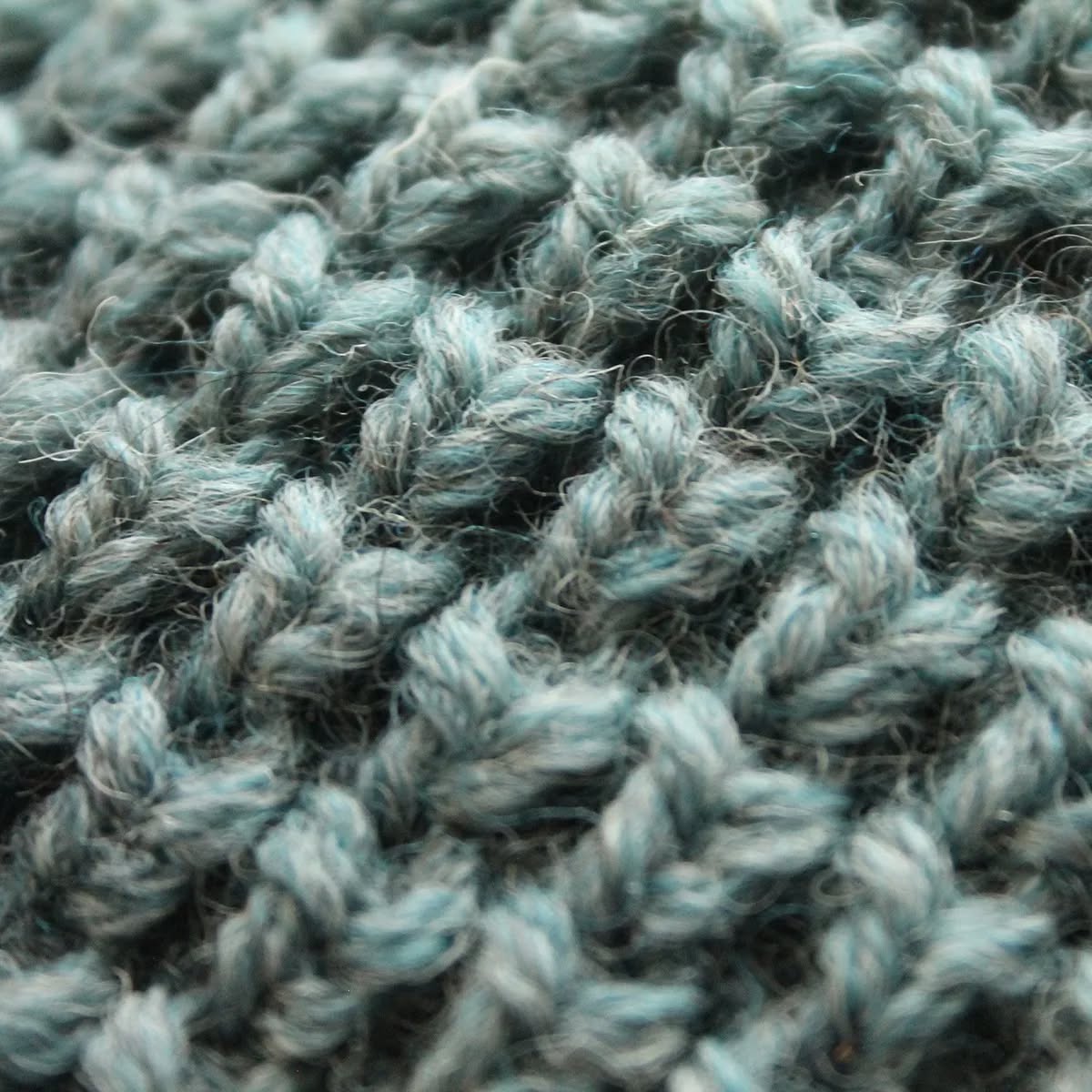 A close up of the waffle stitch, knit using our 100% pure new wool in shade 064 Summerstorm from our Pennine Collection.
#britishwool #choosewool #shepleyyarns #sustainableyarns #naturalfibres #renewablefibres #woolindustry #knittedtextures #ageoldtechniques #craftmanship #luxuryyarns #woolforfashion