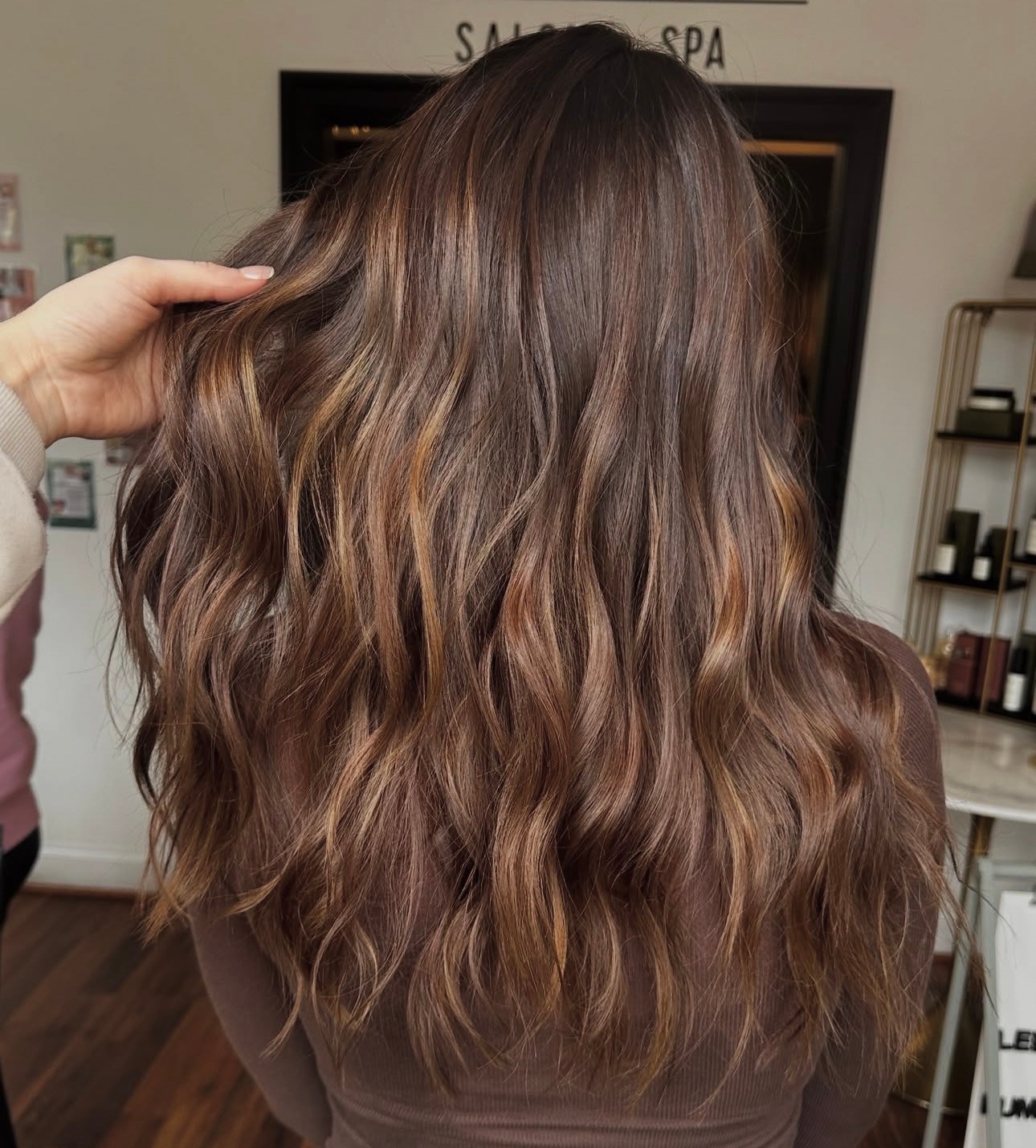 Seasoned Stylist Alycia created this deep chocolate base with soft ribbons of caramel that create warmth, shine, and movement. This is one of those colors that looks good in every light and grows out easily. Who says brunettes are boring?