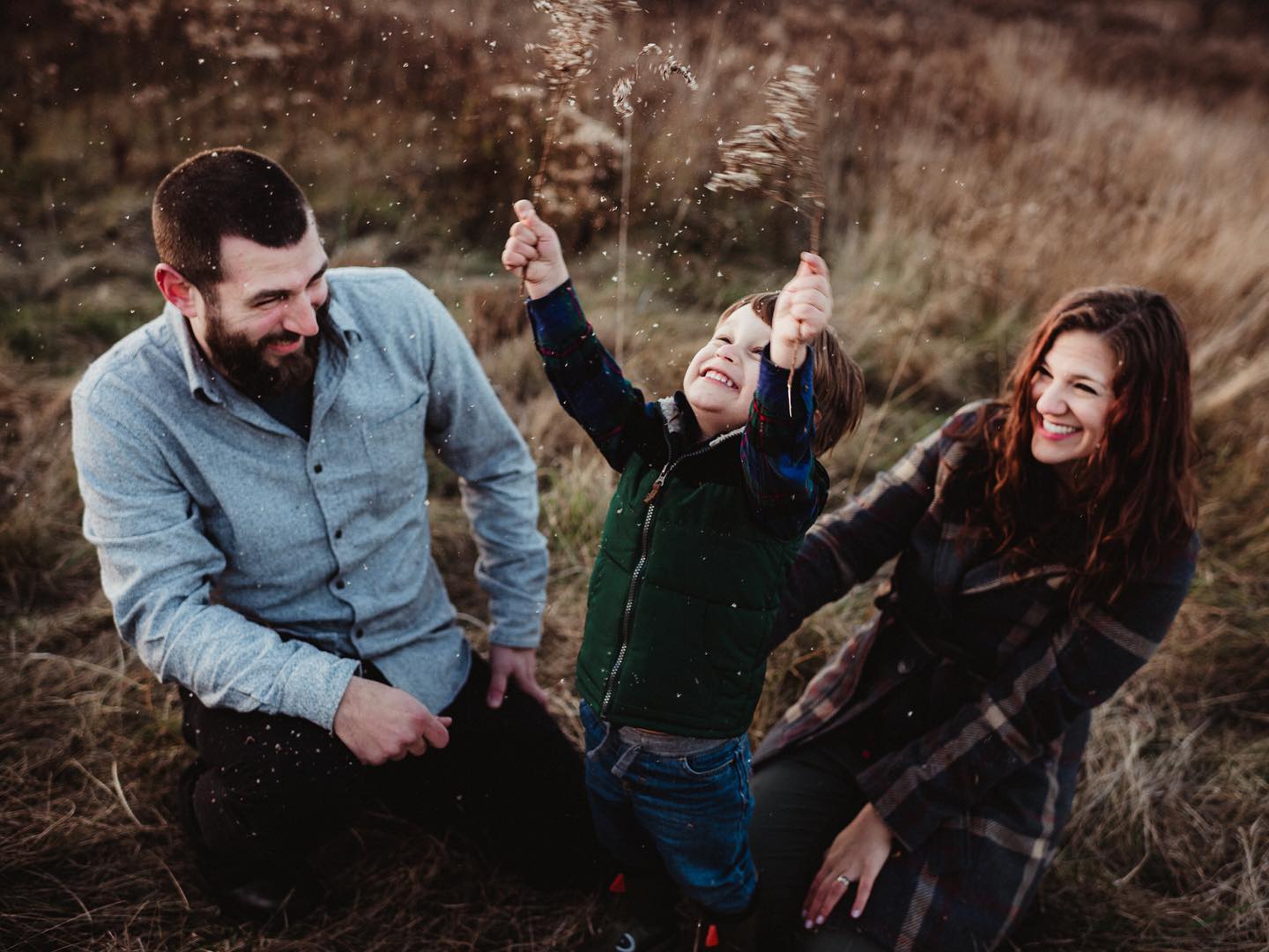 He loved making it “snow” on mom and dad! So cute!! #rochesternyphotographer #rochesternyfamilyphotographer #lifestylephotography #love #fall #sunset #familysession
