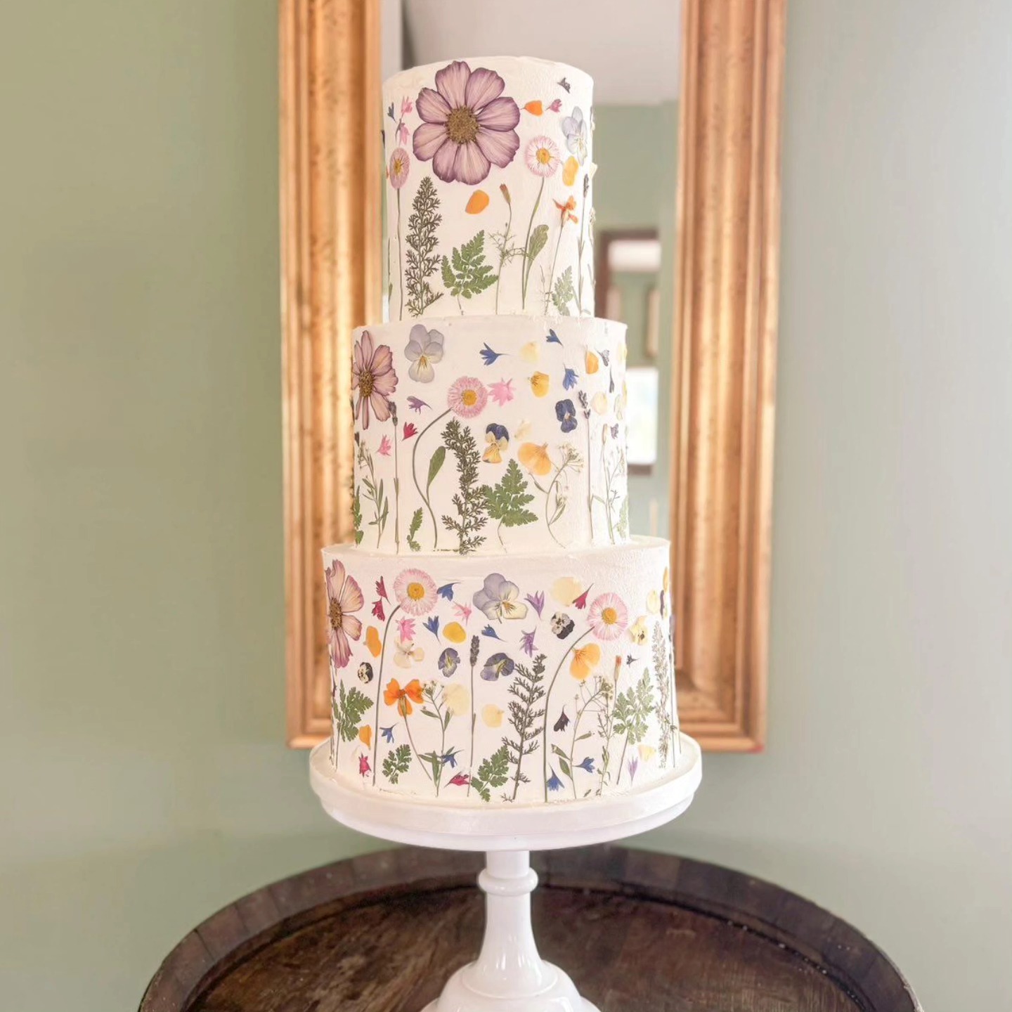 An elegant three tier masterpiece
This gorgeous cake by @theprettycakecompany is dressed in layers of soft summer meadow blooms - blush pinks, buttery yellows and delicate blues.
Timeless elegance, with a playful burst of meadow magic.
#cakedecor
#weddingcakes
#botanicalcake
#weddingmagic
#pressededibleflowers
#pressedflowercake
#weddingcakeinspiration