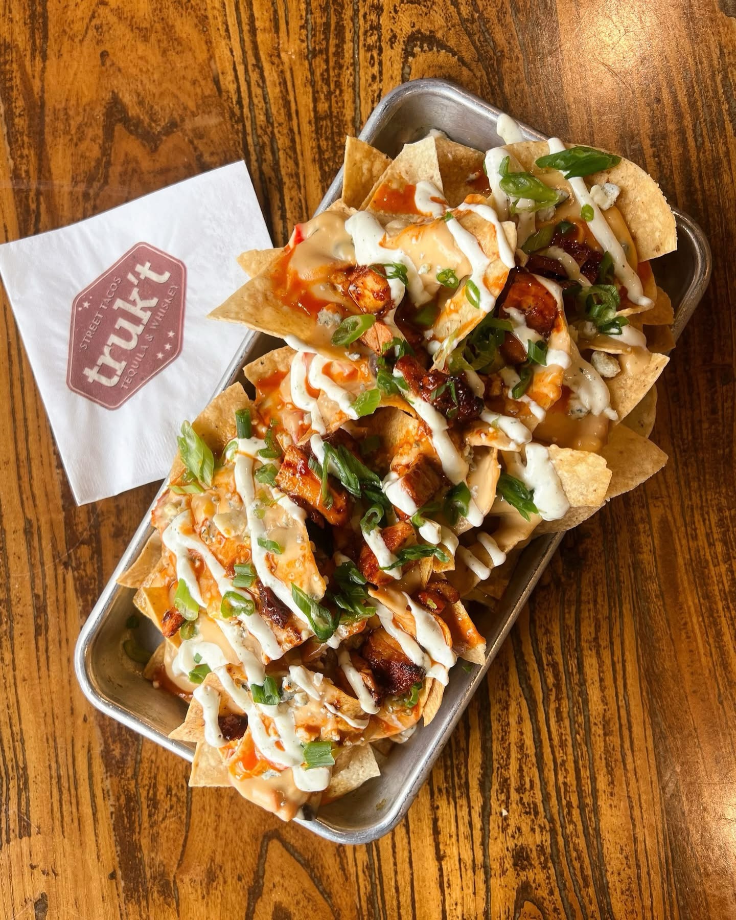 W.T.F. – weekly truk’t feature
BUFFALO CHICKEN NACHOS – grilled chicken, house made buffalo sauce, southwest queso, ranch dressing, blue cheese, green onions
Available through 2/1.