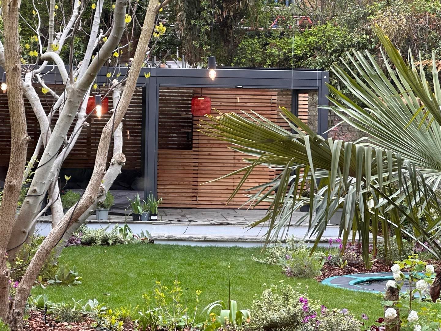 Lighting is completed ….we weren’t sure how the bare bulbs in the trees would look but we are pretty happy with the result . #gardenlighting #lightsintrees #contemporarygarden #coolgardenlights #gardenpendants #coolgardenshades