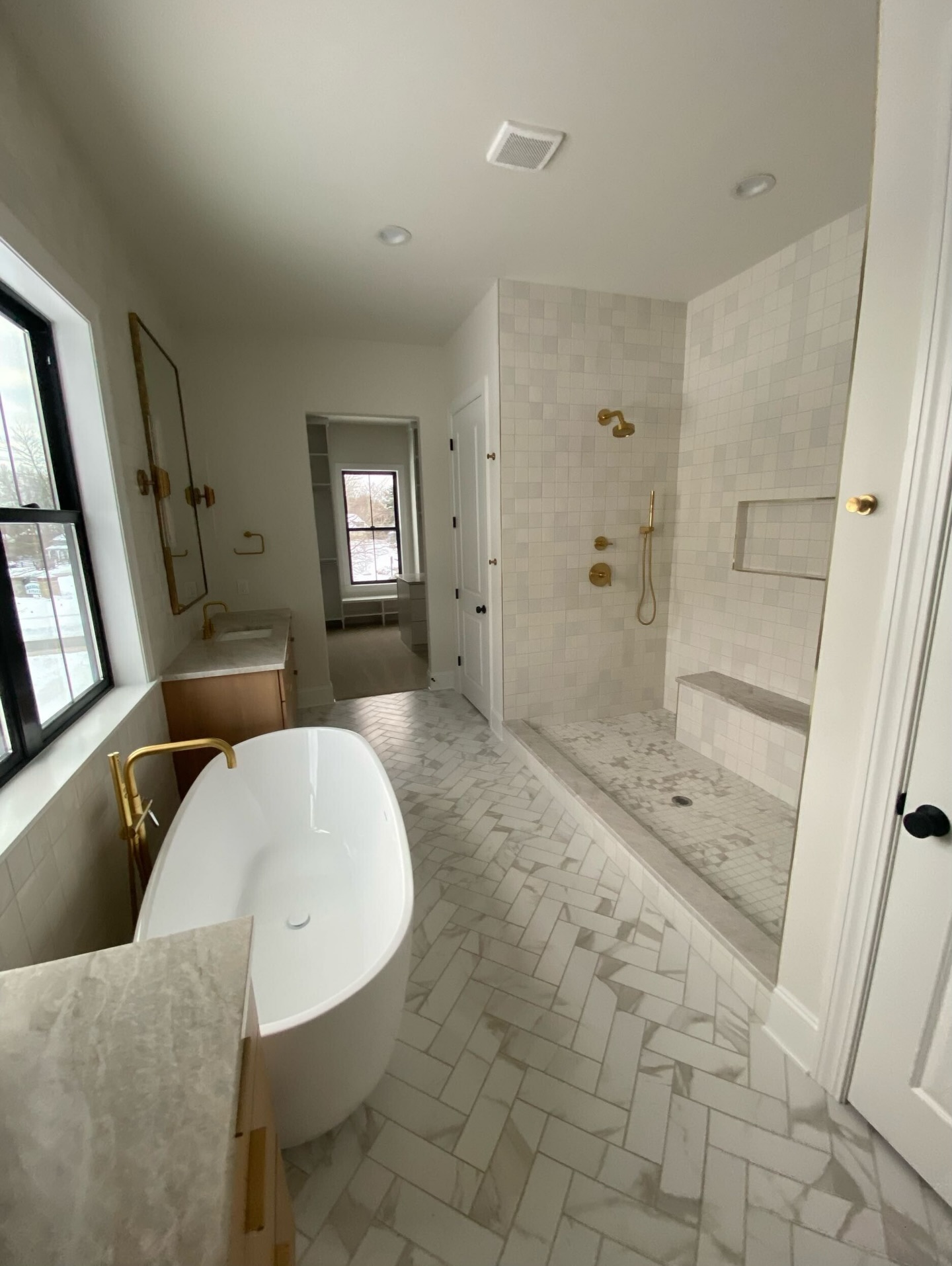 A primary bath designed to stand the test of time. Soft neutrals, classic tilework, and warm brass details—made even more special by the custom feel of the zellige tile. Effortless, elevated, and truly timeless. Thank you, @oldworldcustomhomes! #timelessdesign #primarybath #neutralbathroom #classicinteriors #zelligetile