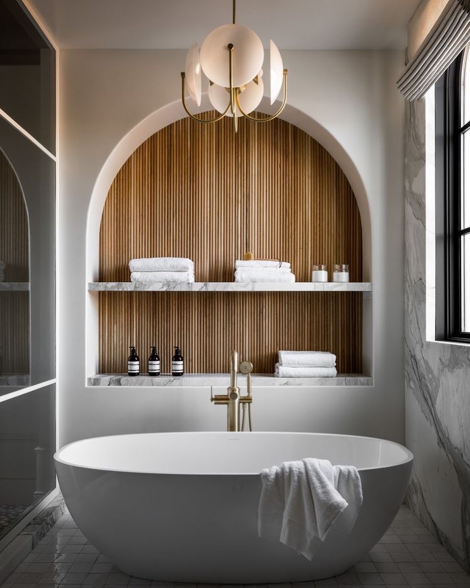 Details in bathrooms ๐
Bathrooms are one of those spaces that often get ignored when it comes to the finer details.
When designing a bathroom people think of the big things, like what bath am I going to have, or what tiles would I like on the floor, but we tend to forget to think outside the box in bathrooms.
This inspirational picture shows a wall inset with beautiful wooden slats to create a unique detail in this space. These wooden slats really add warmth to the room, as well as giving it that wow factor.
What could you do in your bathroom to make it stand out from the rest? ๐ญ