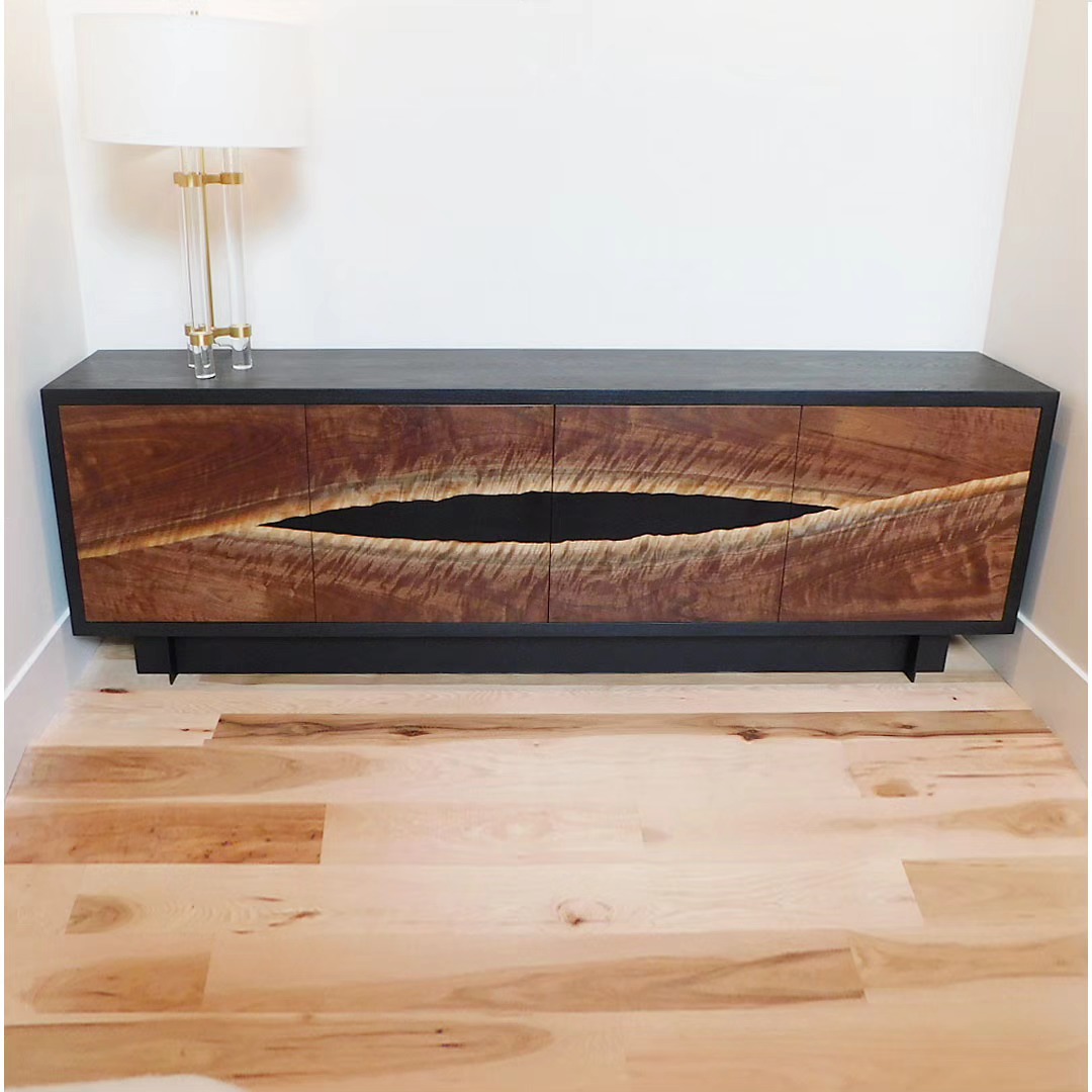 This coveted curly walnut slab was the perfect candidate for this custom console. We resawed bookmatched veneers to form the door panels. Housed in a blackened ash case with a steel base, it plays off our client's I-beam fireplace detail and other interior surroundings. Glad to have great repeat clients who let us run with our vision to produce pieces we love.
.
.
.
#customfurniture #interiordesign #credenza #console #blackwalnut #customdesign #steelwork #metalfabrication #woodworking #details #bespokefurniture #moderndesign