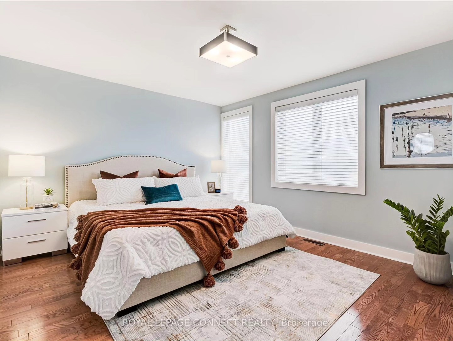 Cognac anyone? We couldn't change the floors, so we used a colour palette to enhance them.#cognacisback #cognacaccents #primarybedroominspo #blueandcognac #stagingsells #torontohomestaging #torontorealestate #torontostaging #fabulousbedroom #terryclothbedding