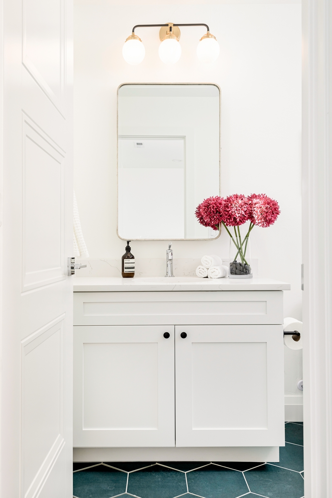 💙✨ A perfect blend of modern and classic charm! ✨💙
This bathroom features clean white cabinetry paired with stunning blue hexagonal tiles for a bold yet timeless look. Mid-century-inspired globe lights over the vanity add a touch of retro elegance, creating a space that’s both stylish and functional.
💡 Design Tip: Complement vibrant tiles with neutral accents to strike the perfect balance and let the color shine.
Interior Design: @everydaylovelydesign
Project: Ash
Builder: @smithandmeade
Photographer: @natepolta
Stager: @staged5280
#BathroomInspo #BoldDesignChoices #EverydayLovelyDesigns #MidCenturyModern #InteriorDesignIdeas