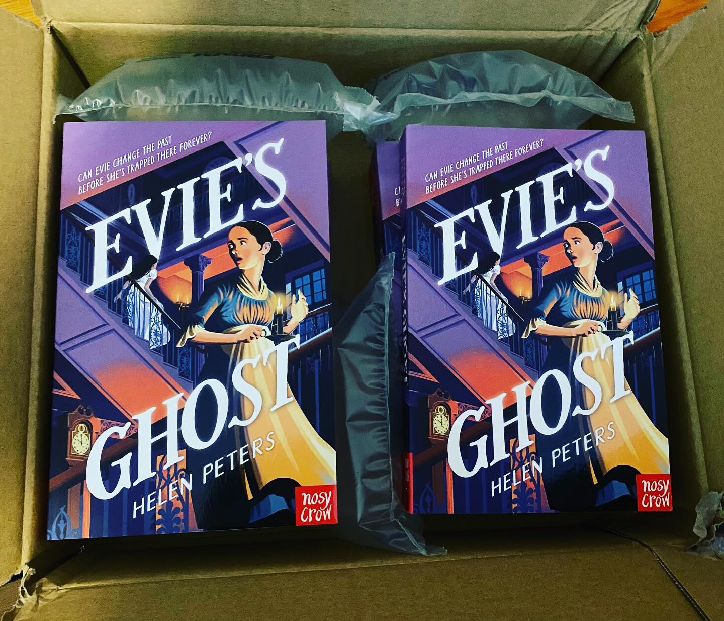 Look at this glorious book post! My spooky timeslip mystery adventure story, EVIE’S GHOST, is being reissued by @NosyCrow on Thursday with this gorgeous new cover by the amazing David Dean.
On her first night in a new house, Evie sees a strange message scratched on the windowpane. Then, as the clock strikes midnight, she hears a tapping on the glass. Opening the curtains, she sees the face of a girl staring in at her. As she screams and runs from the room, the house changes around her and she finds herself out in the candlelit corridor, wearing a maid’s uniform. What is happening to her? And will she ever work out how to return to her own time?