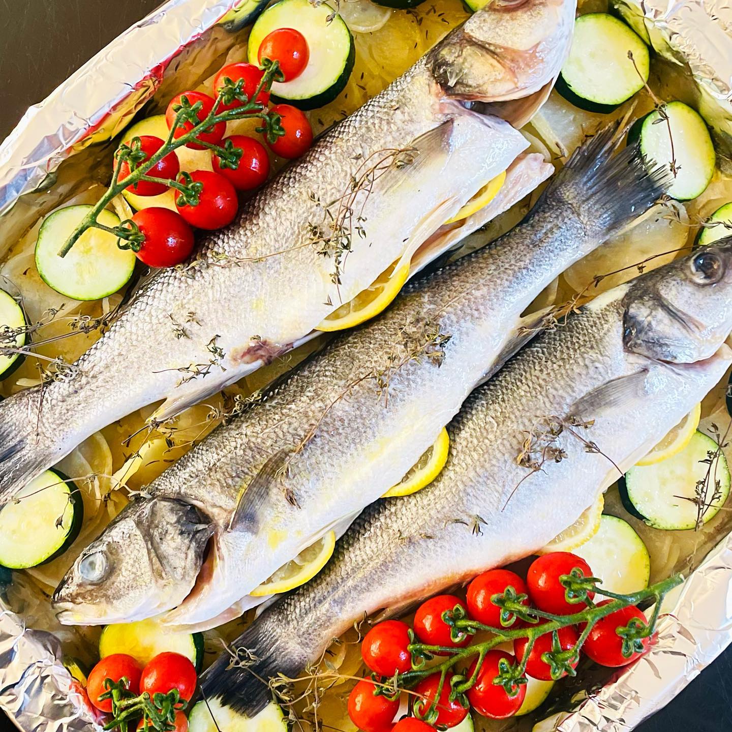 Sea Bass & Veggie Tray
Whole fish on a bed of thinly sliced potatoes, sliced courgettes, Sugarbelle tomatoes, Lemon & Thyme, all sprinkled with crystal sea salt & drizzled with olive oil
#nomeatmonday #fish #veggietray #healthyfood #yummy #picoftheday #ovenroasted #easyrecipes
